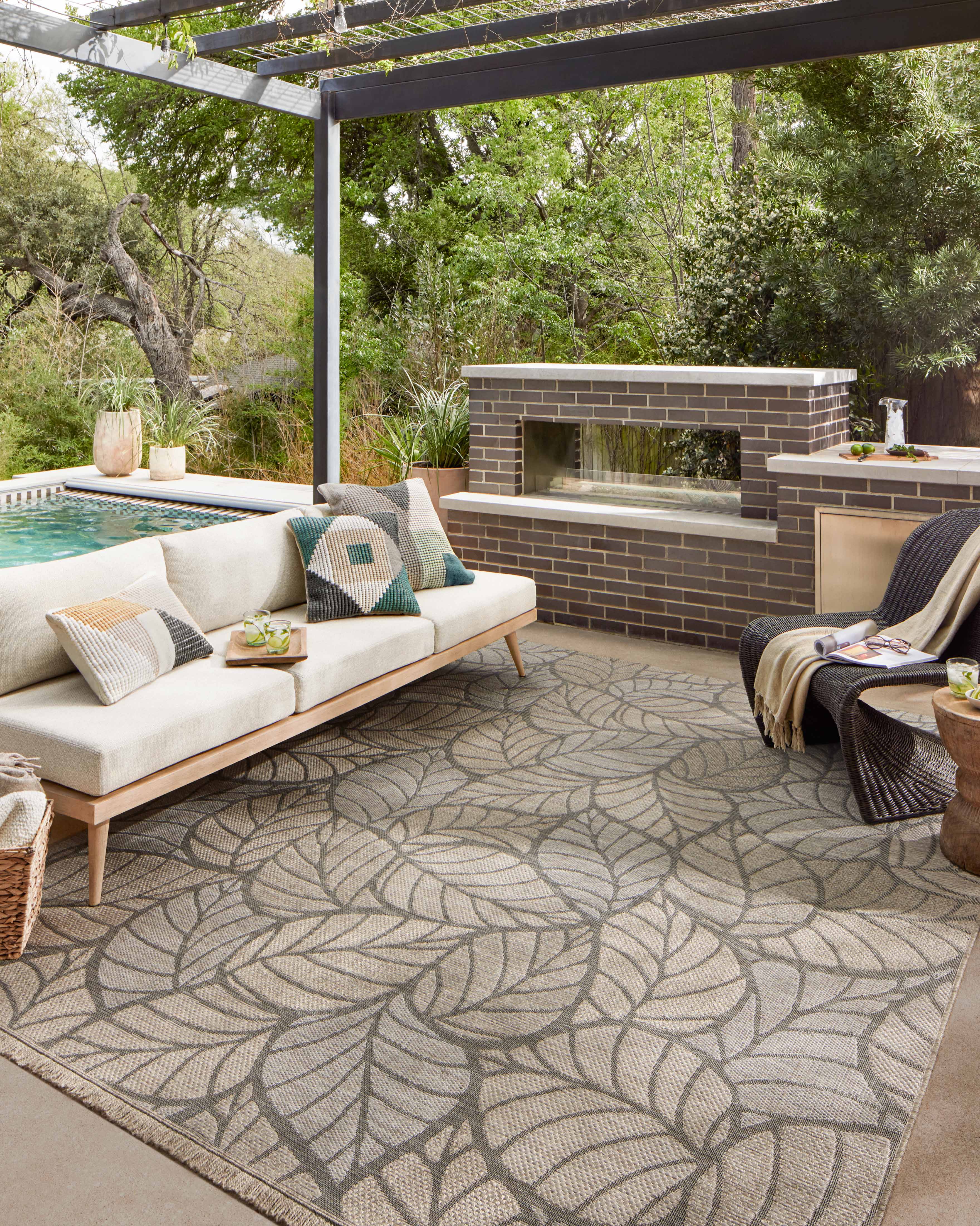 Neutral-toned Loloi Dawn Collection indoor/outdoor rugs with woven sisal look, short fringe, and modern graphic patterns.