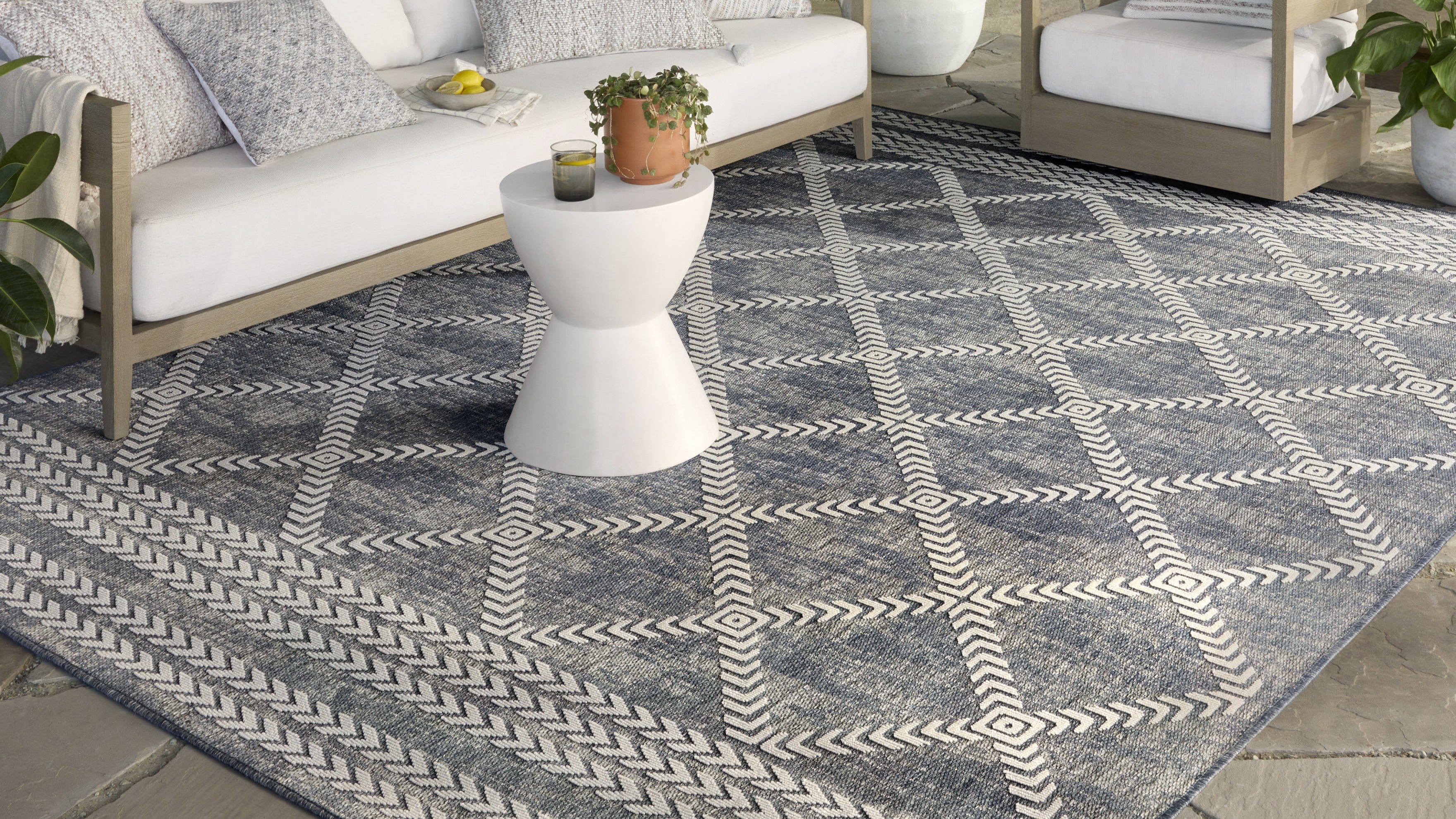 Stylish rug from the Loloi Rainier Collection featuring a contemporary design in neutral colors, perfect for indoor and outdoor use. Made from 100% polypropylene pile for durability, it enhances any space with elegance.
