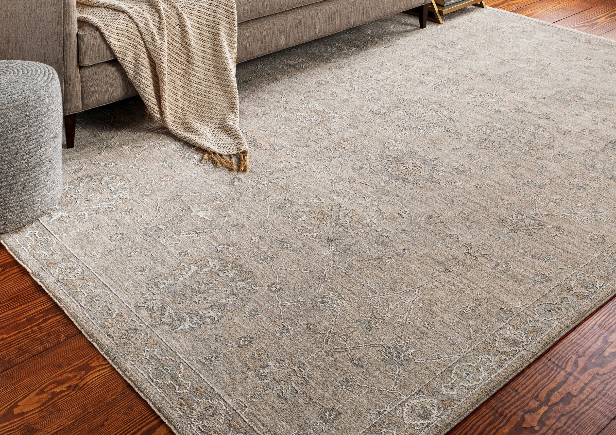 Beige area rug adding warmth and elegance to a stylish modern living room