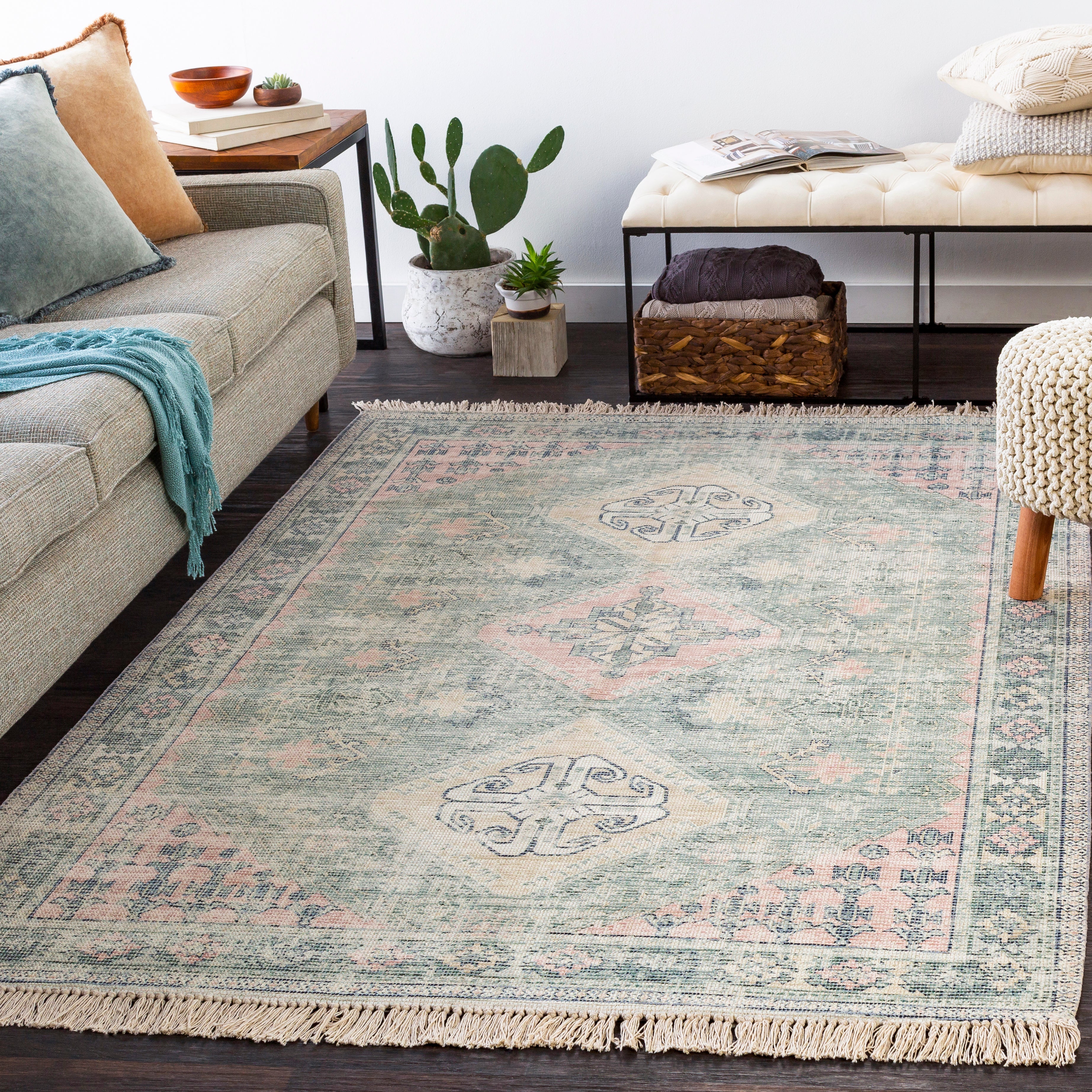 Livabliss Zainab Area Rug, a sophisticated and classic piece that will enhance your home decor. Hand-woven from a cotton-polyester blend, it offers durability and comfort underfoot.