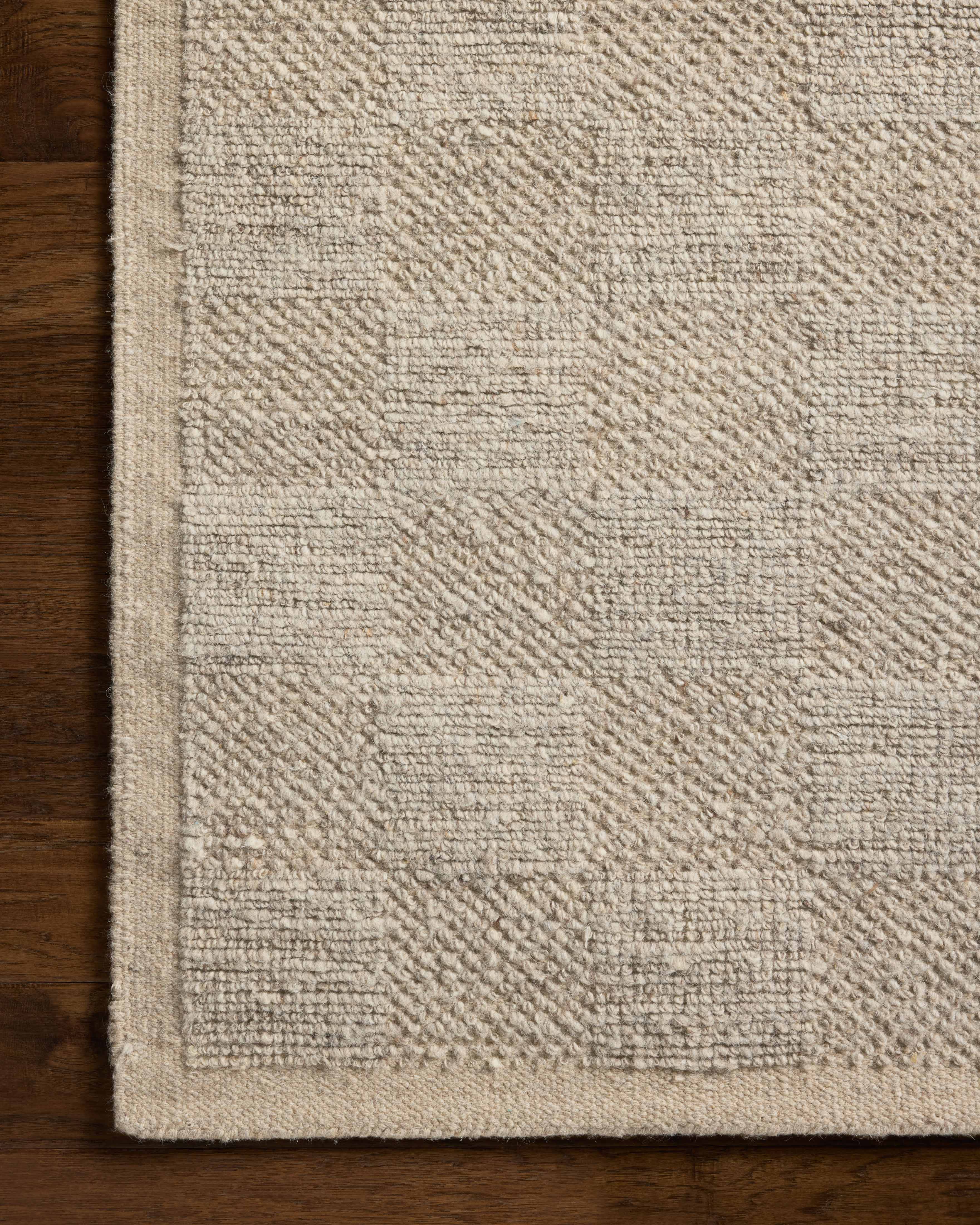 A hand-woven wool area rug with gentle dove tones, the Alina ALN-01 Dove Area Rug adds character to any room