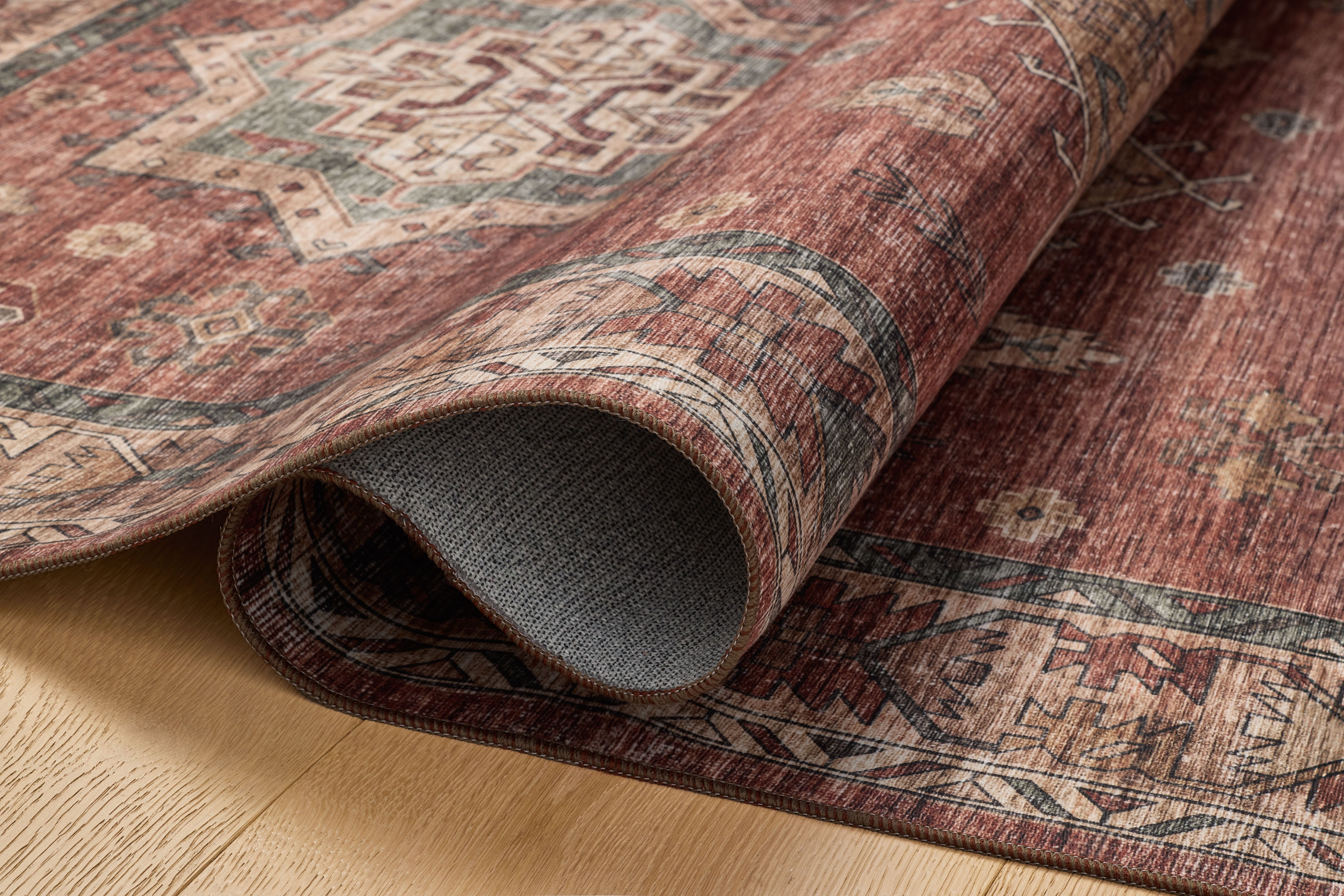 The Anniston ANS-04 Spice / Multi Area Rug showcases spirited spice and vibrant multi-toned tones in a power-loomed polyester area rug with traditional and distressed style