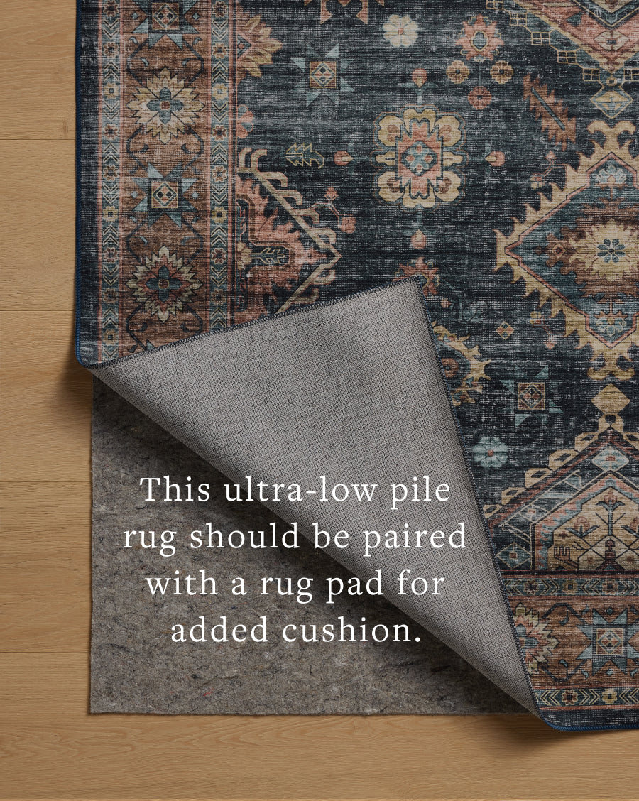 Layered in casual denim and glowing sunset hues with traditional and distressed patterns, the Anniston ANS-03 Denim / Sunset Area Rug is a power-loomed polyester area rug perfect for any setting