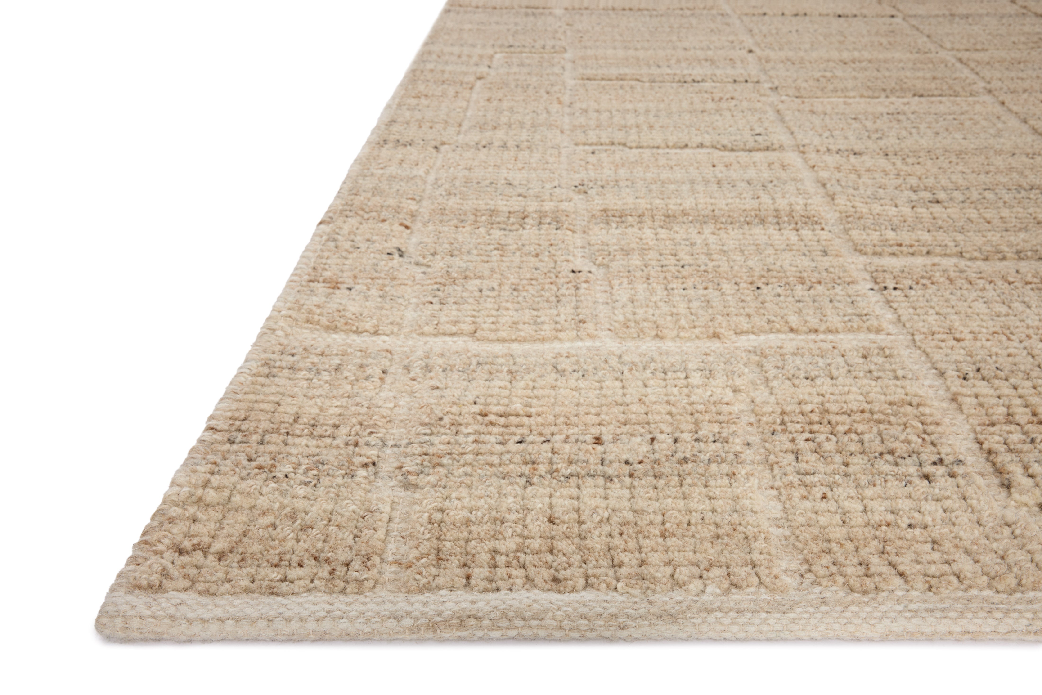 A hand-loomed wool and cotton area rug with contemporary flair in warm natural tones, the Asha ASA-01 Natural Area Rug anchors any room