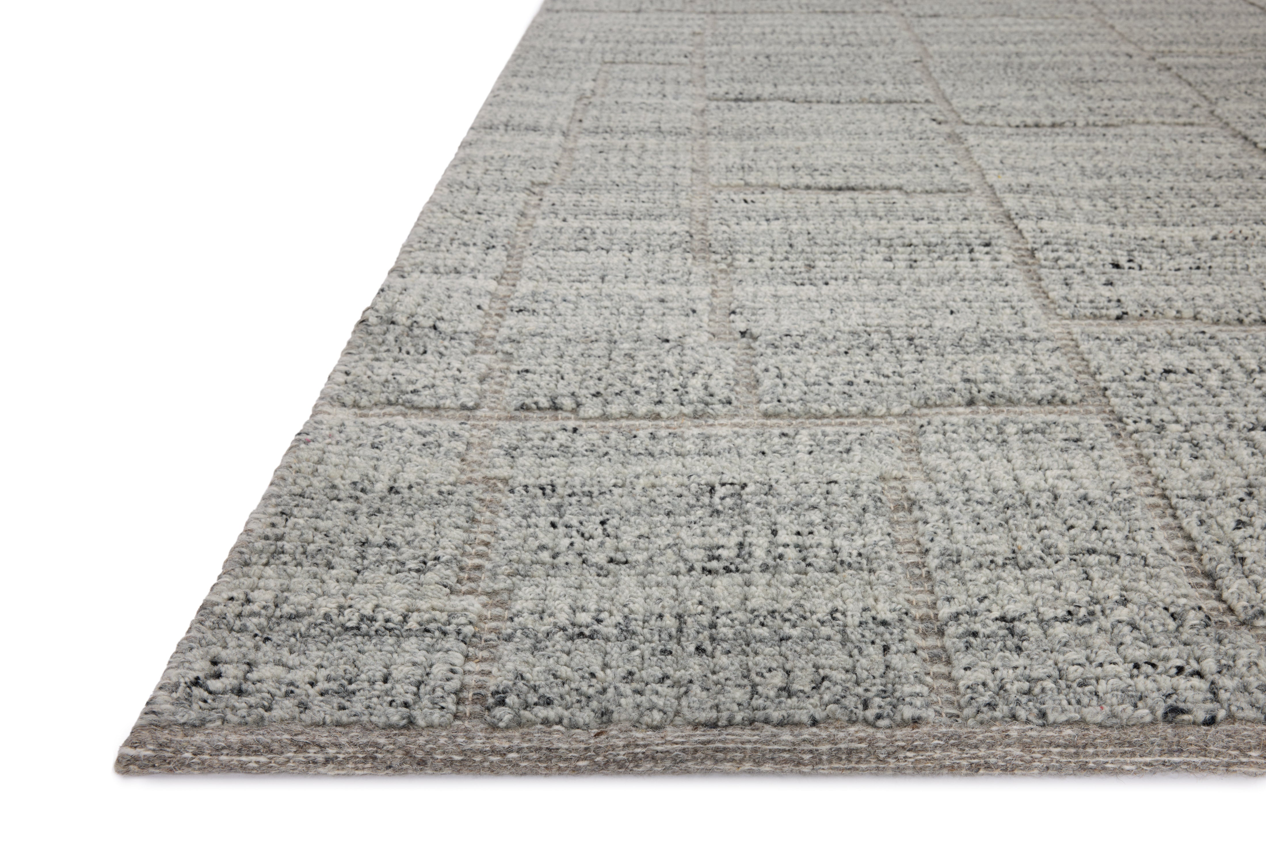 The Asha ASA-01 Sky Area Rug pairs breezy sky-blue tones and contemporary patterns in a hand-loomed wool and cotton area rug