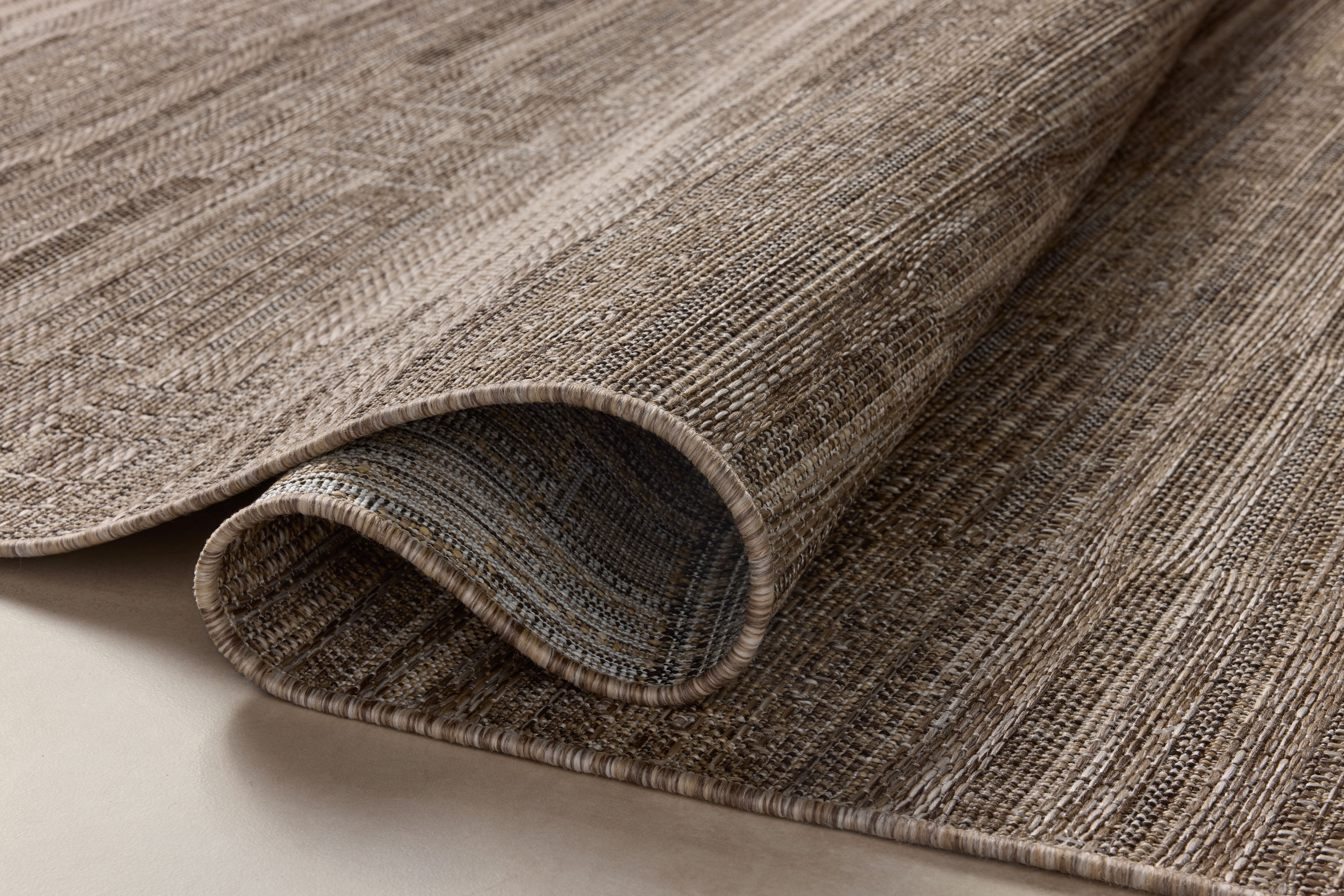 Rich in warm natural and warm beige hues with contemporary and linear detail, the Birch BIR-01 Natural / Beige Area Rug is a power-loomed polypropylene area rug built for style and comfort