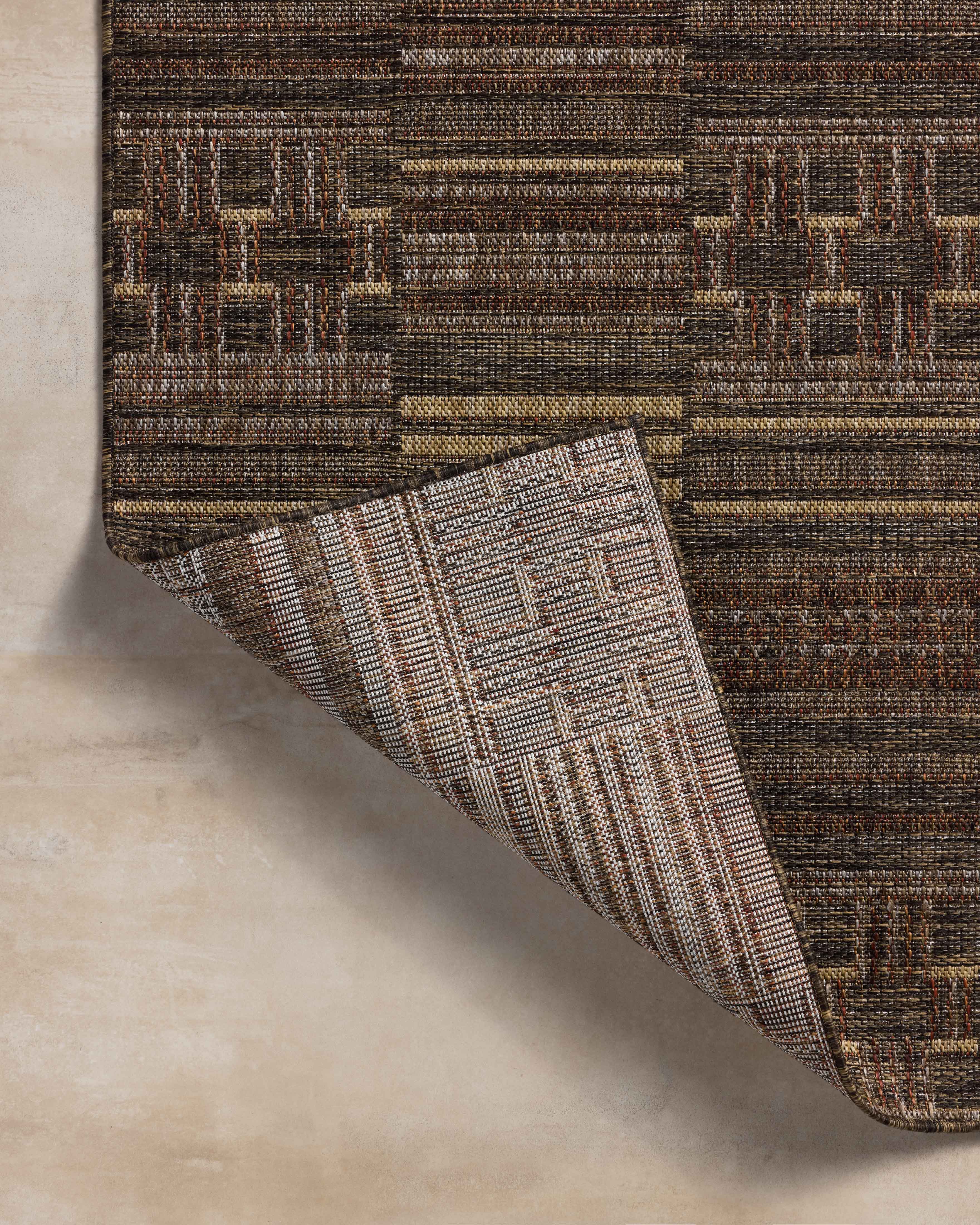The Birch BIR-01 Spice / Tobacco Area Rug offers spirited spice and rich tobacco sophistication and contemporary and linear charm in a power-loomed polypropylene area rug