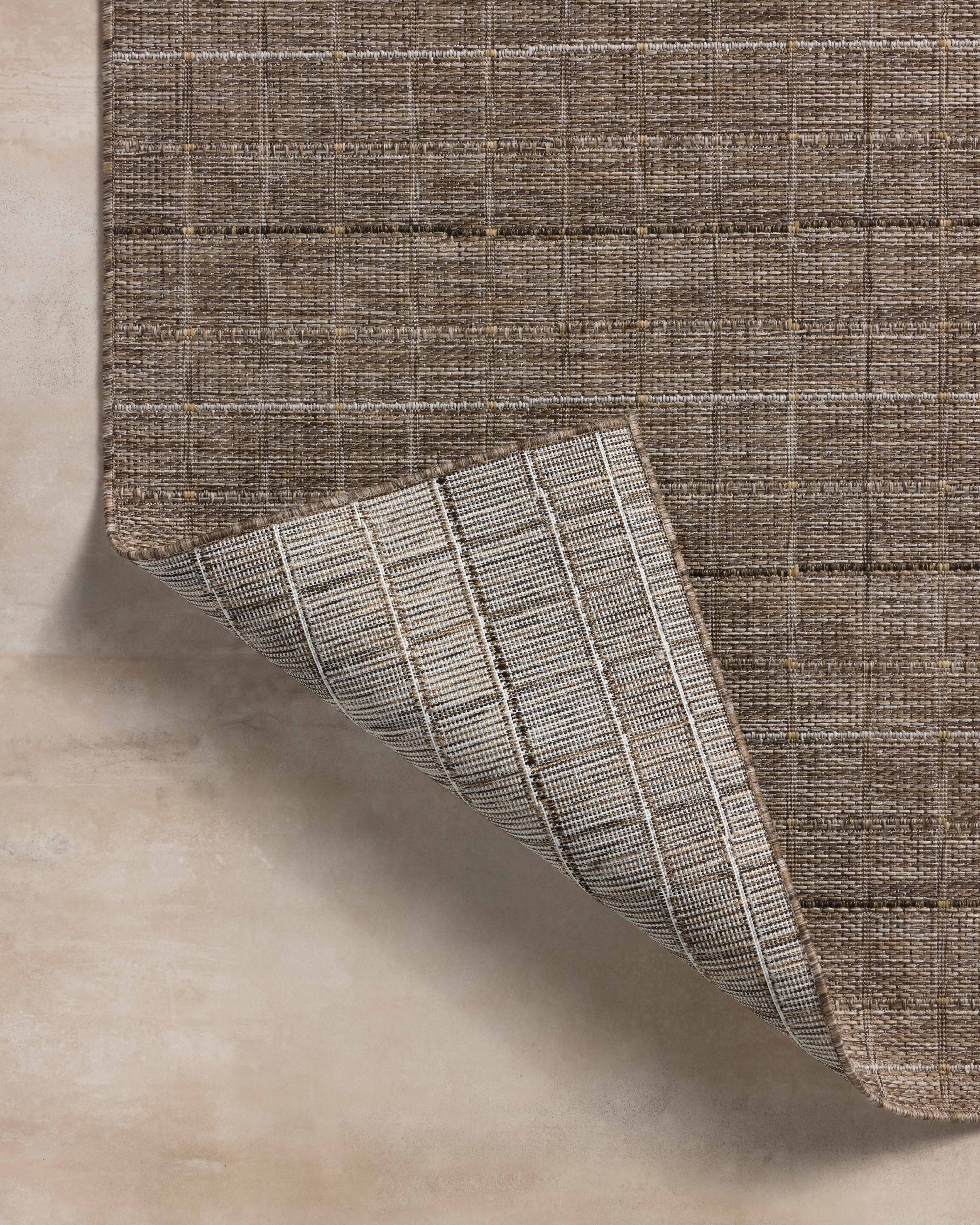 Expertly crafted as a power-loomed polypropylene area rug with contemporary and linear artistry, the Birch BIR-02 Natural / Bark Area Rug captures warm natural and grounded bark tones beautifully