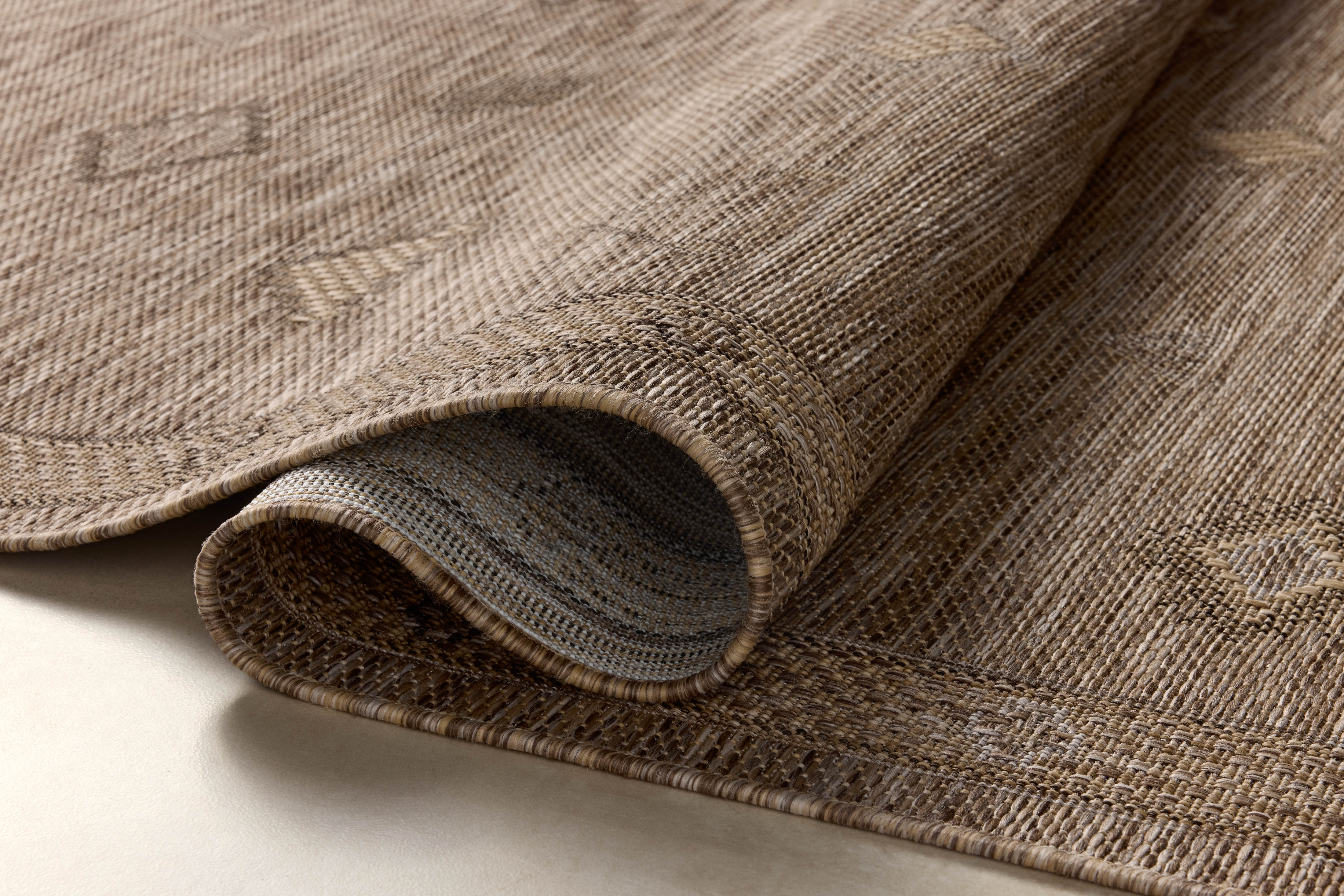 Finished in warm natural and sandy tones with contemporary and linear styling, the Birch BIR-03 Natural / Sand Area Rug is a power-loomed polypropylene area rug for modern living