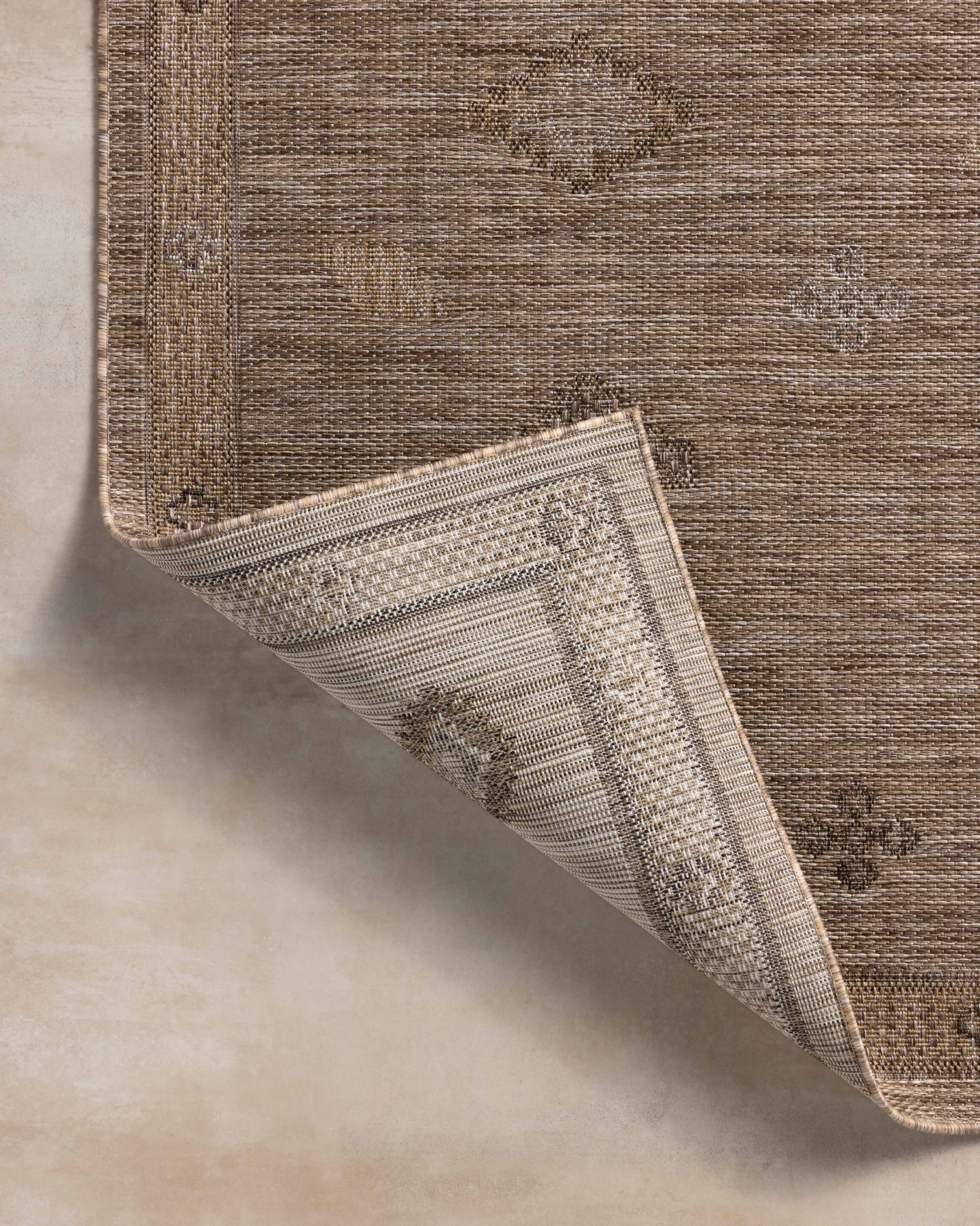 Finished in warm natural and sandy tones with contemporary and linear styling, the Birch BIR-03 Natural / Sand Area Rug is a power-loomed polypropylene area rug for modern living