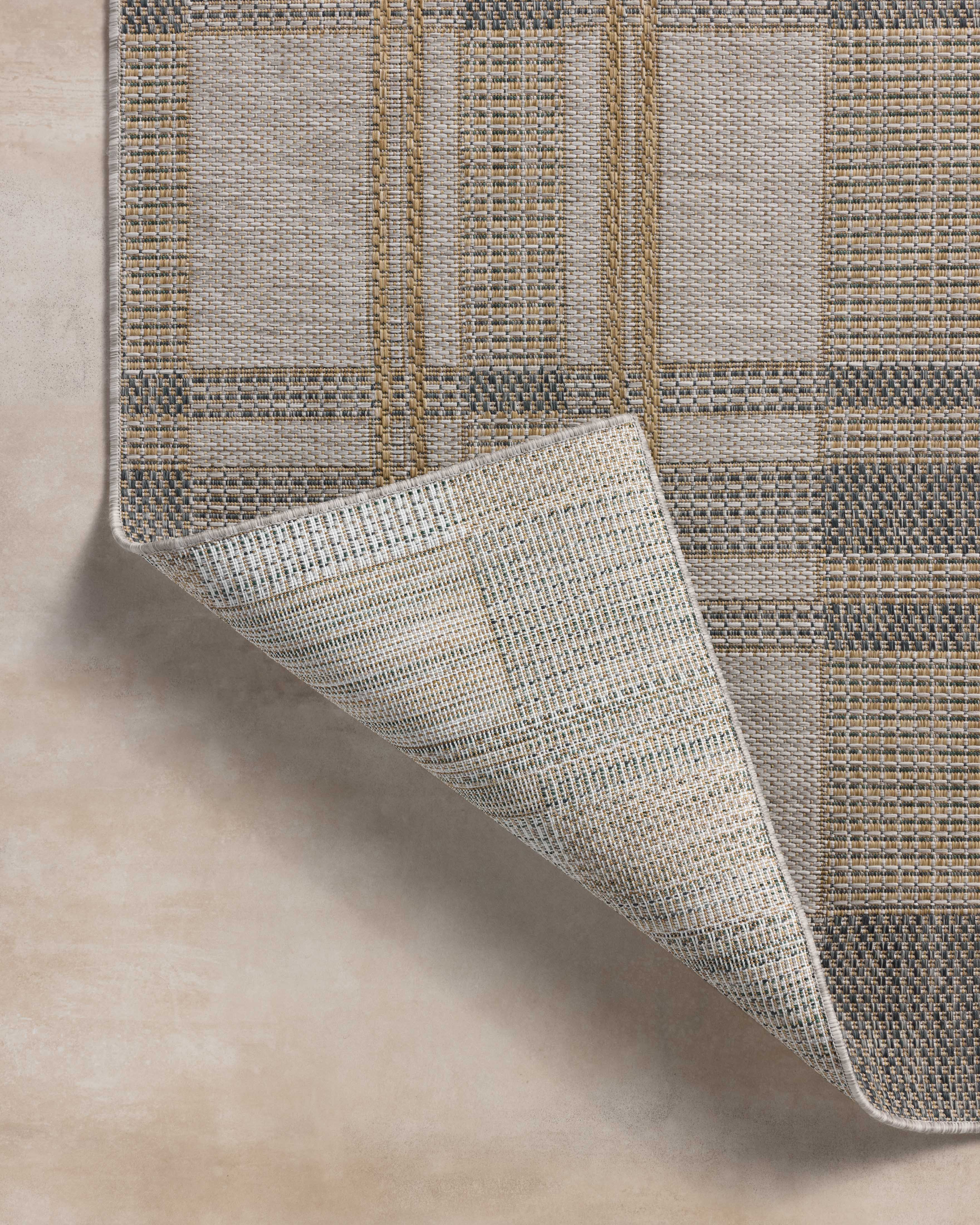 The Birch BIR-05 Bone / Gold Area Rug highlights bone and radiant gold tones and contemporary and linear texture in a beautifully made power-loomed polypropylene area rug