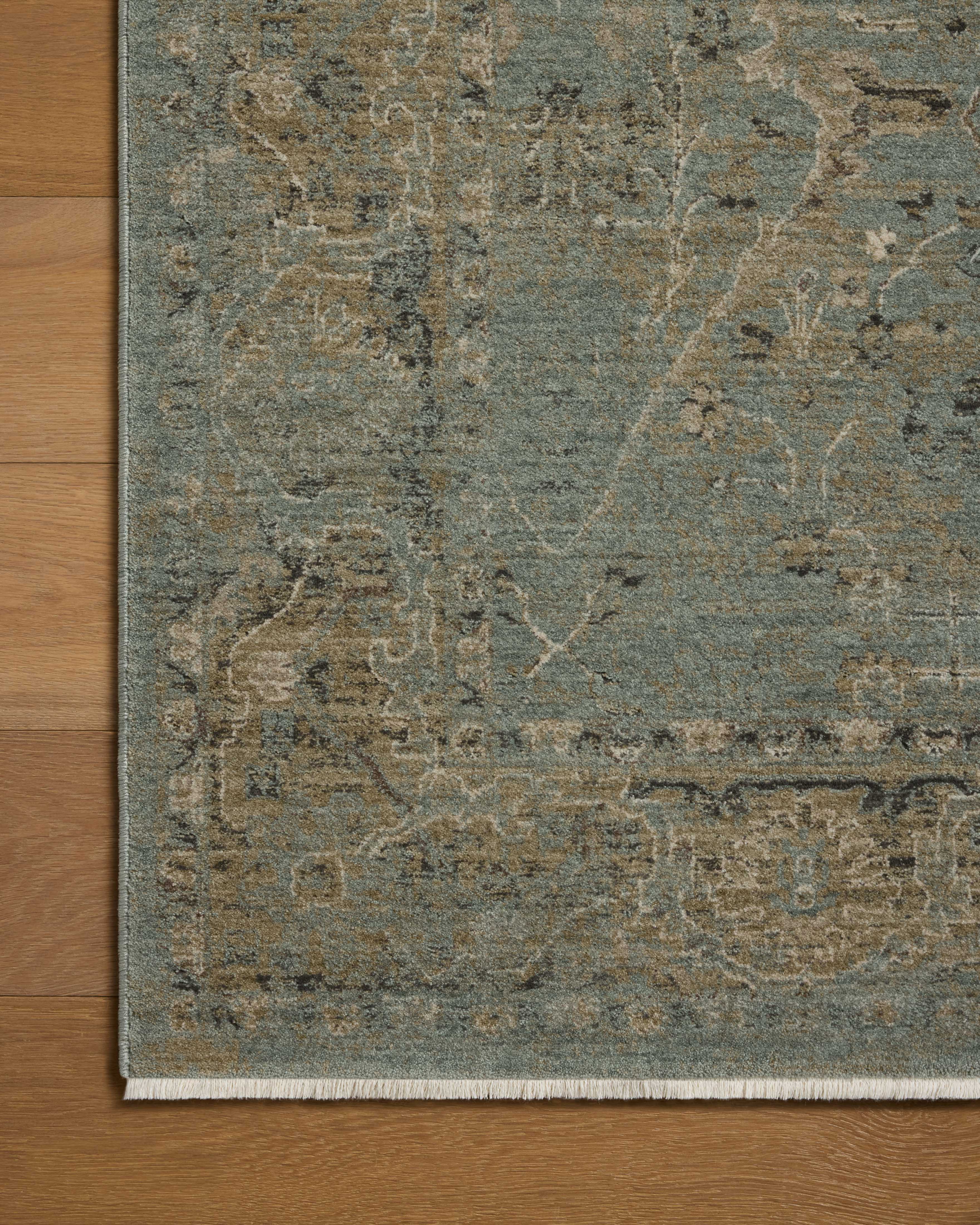 A power-loomed polyester area rug with contemporary and traditional design in aqua and earthy olive hues, the Briar BRR-02 Aqua / Olive Area Rug is a standout in any décor