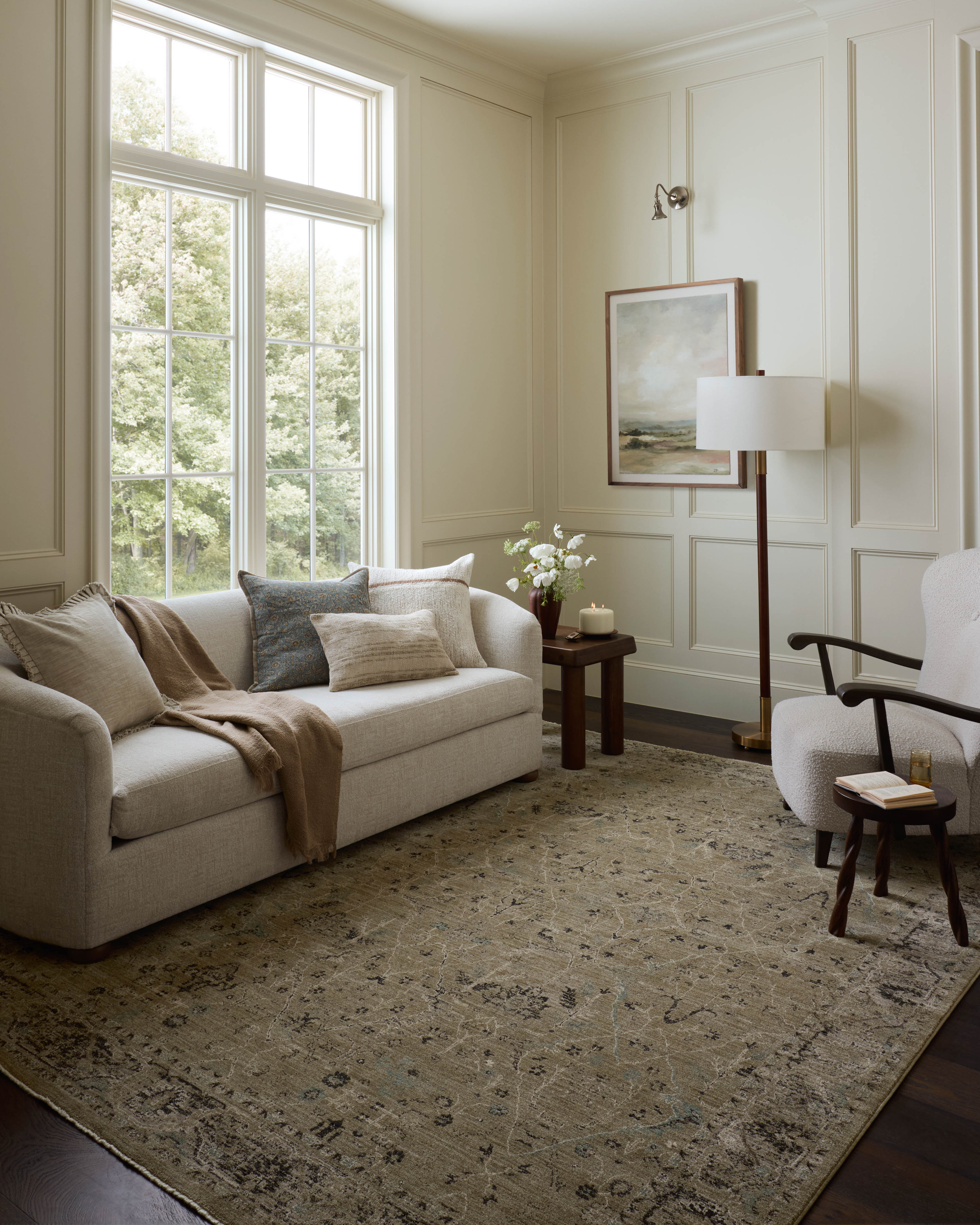 Dressed in earthy olive and grounding stone hues with contemporary and traditional detail, the Briar BRR-02 Olive / Stone Area Rug is a power-loomed polyester area rug that completes any room