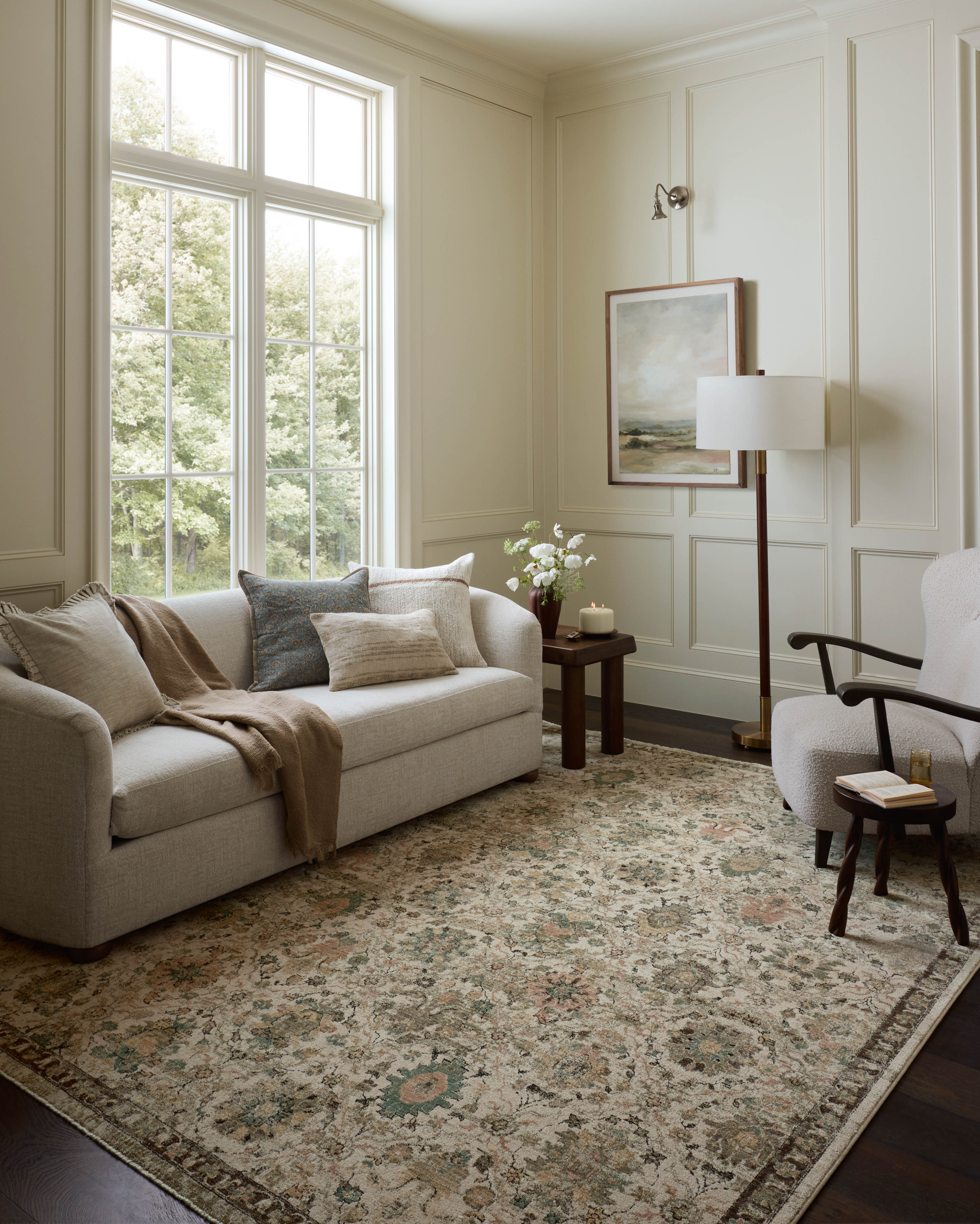 A power-loomed polyester area rug in refined ivory and vibrant multi-toned tones with contemporary and traditional motifs, the Briar BRR-04 Ivory / Multi Area Rug grounds your room beautifully