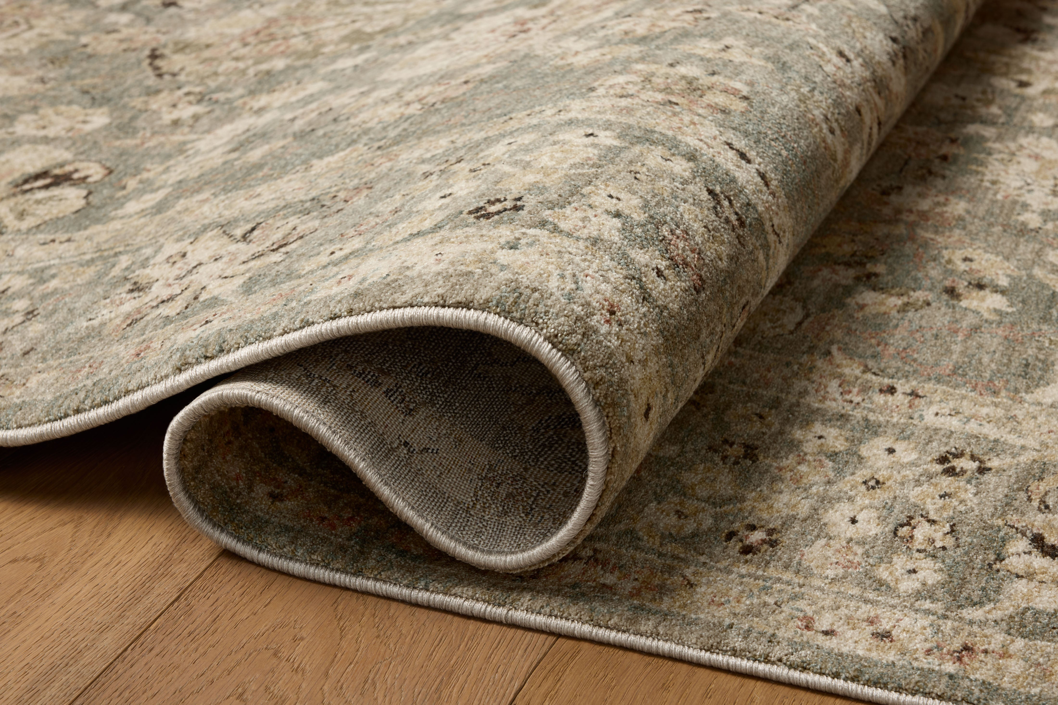 Layered in misty and sandy hues with contemporary and traditional patterns, the Briar BRR-05 Fog / Sand Area Rug is a power-loomed polyester area rug perfect for any setting