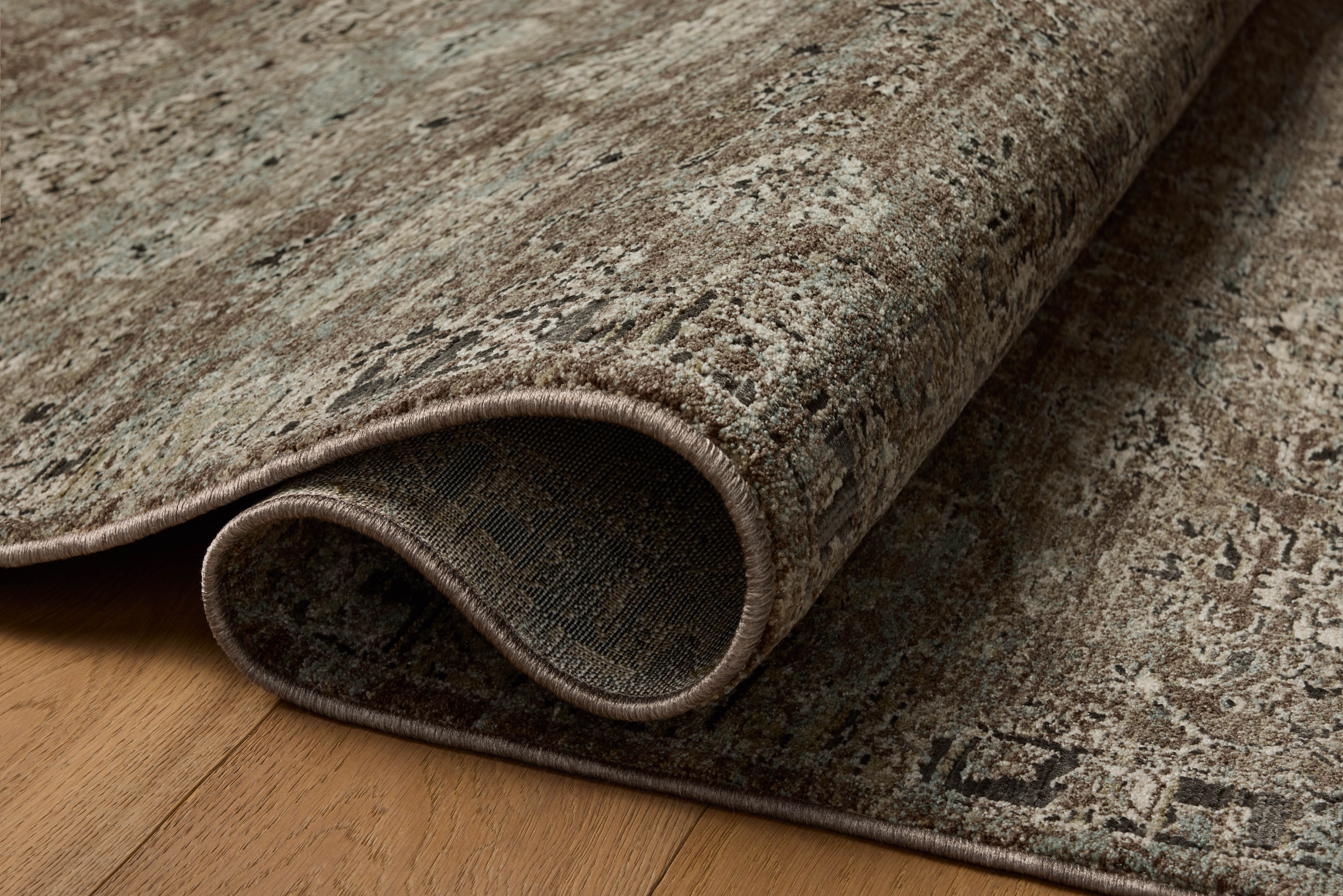 The Briar BRR-06 Bark / Lagoon Area Rug showcases grounded bark and tranquil lagoon tones in a power-loomed polyester area rug with contemporary and traditional style