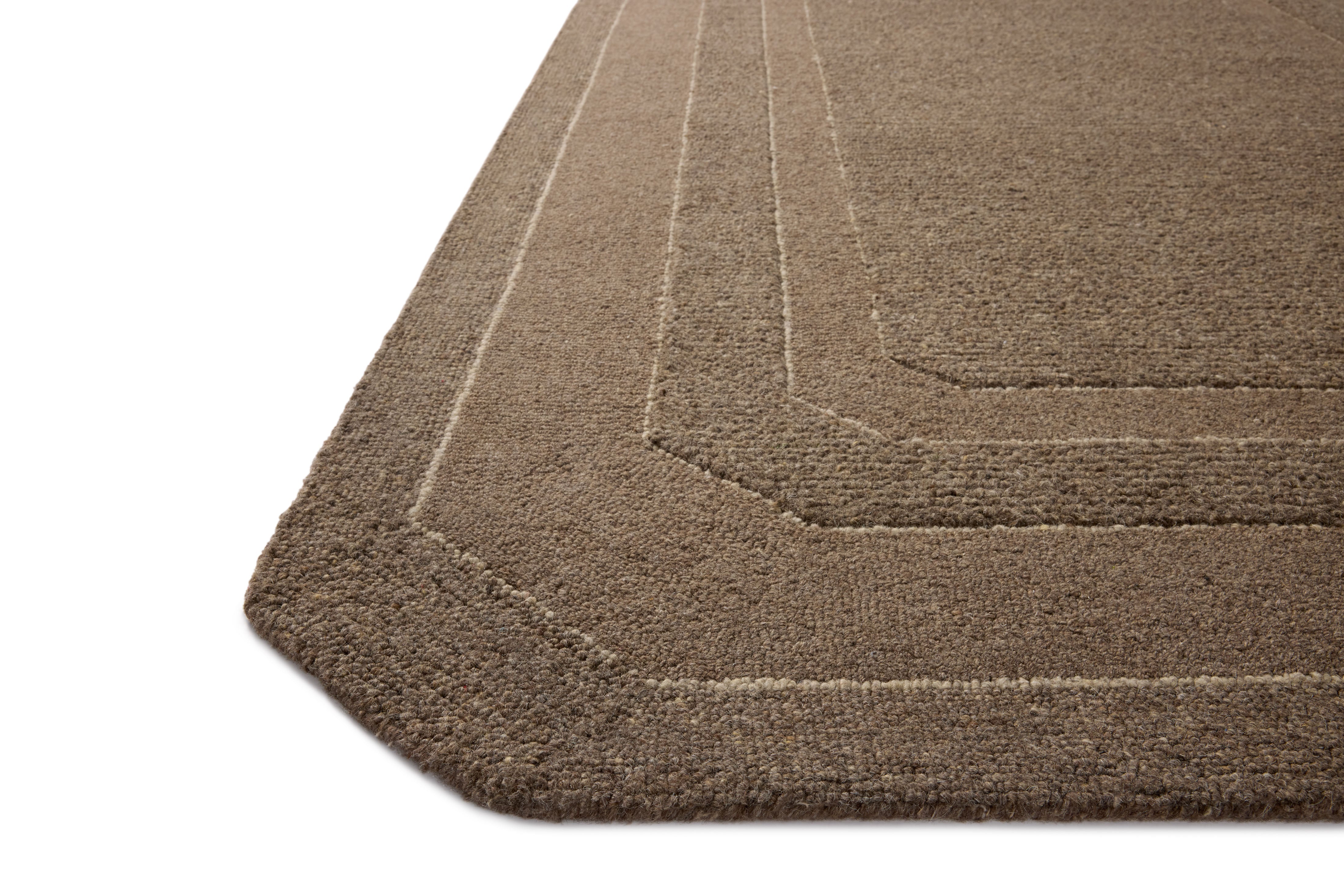 The Clayton CLN-01 Bark Area Rug transforms any space with grounded bark tones and traditional design in a hand-tufted wool area rug
