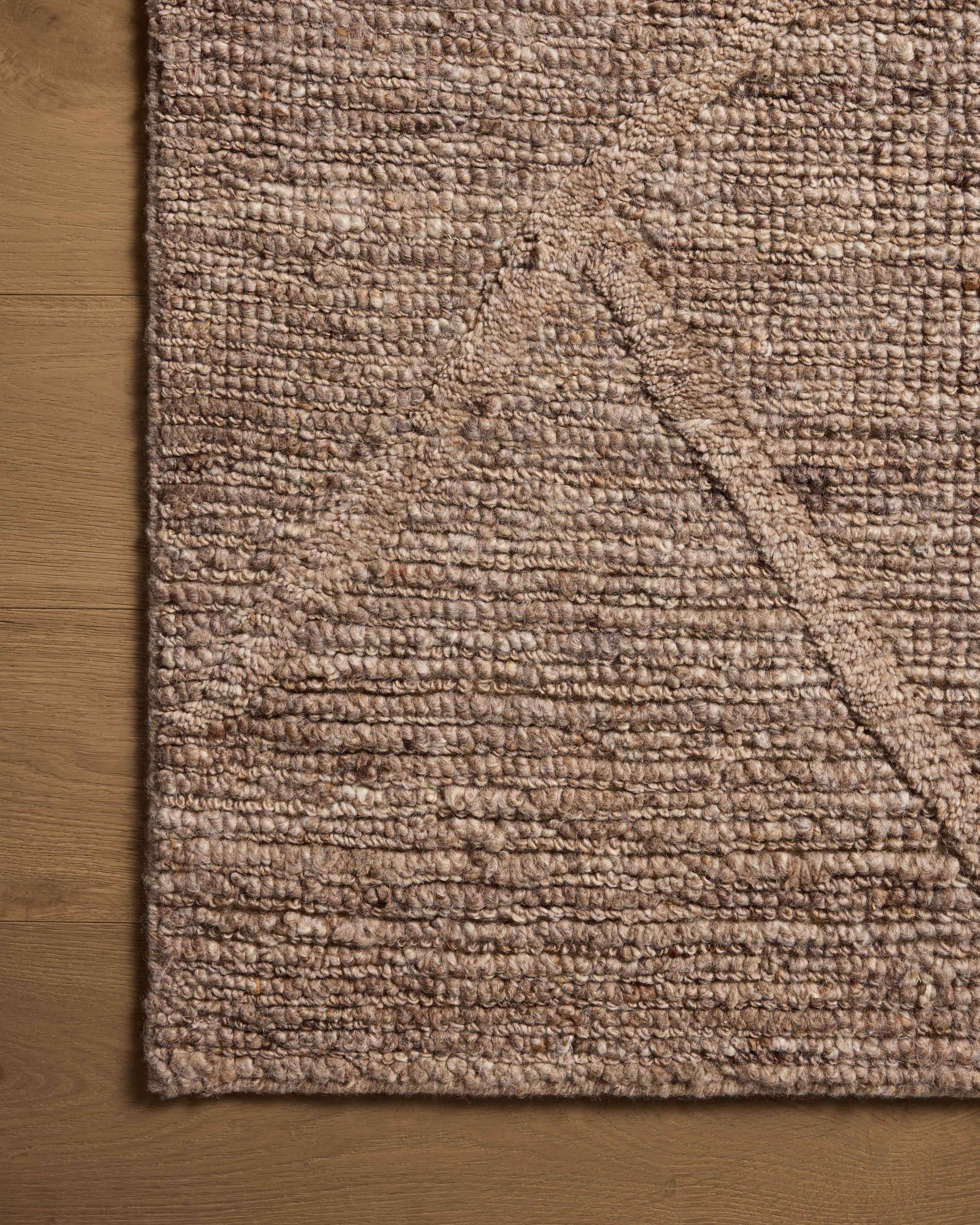 With luxurious mocha hues, the Cline CLI-01 Mocha Area Rug is a hand-woven 100% wool area rug that elevates any room