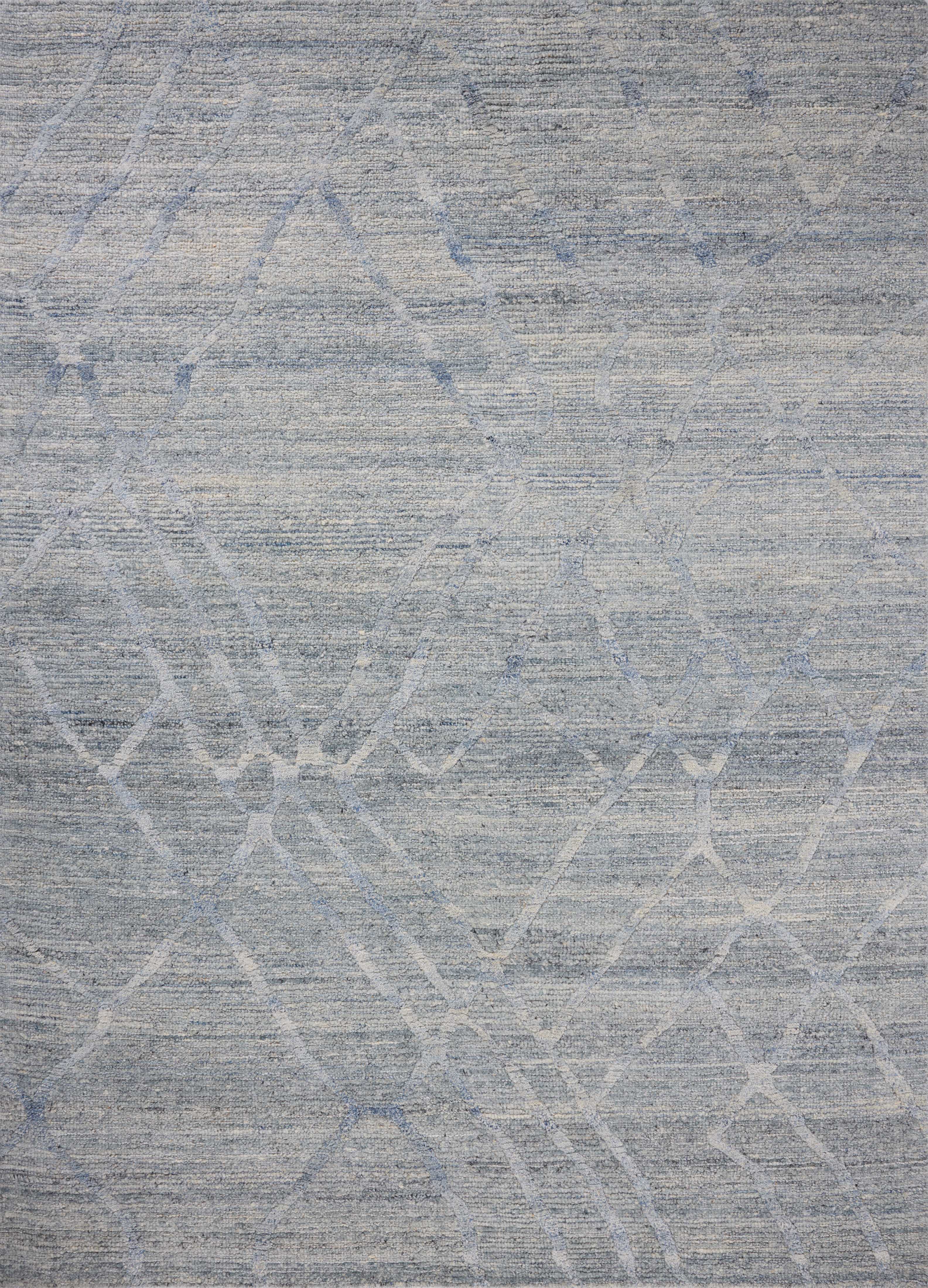 The Cline CLI-01 Sky Area Rug blends breezy sky-blue tones into a hand-woven 100% wool area rug with timeless appeal