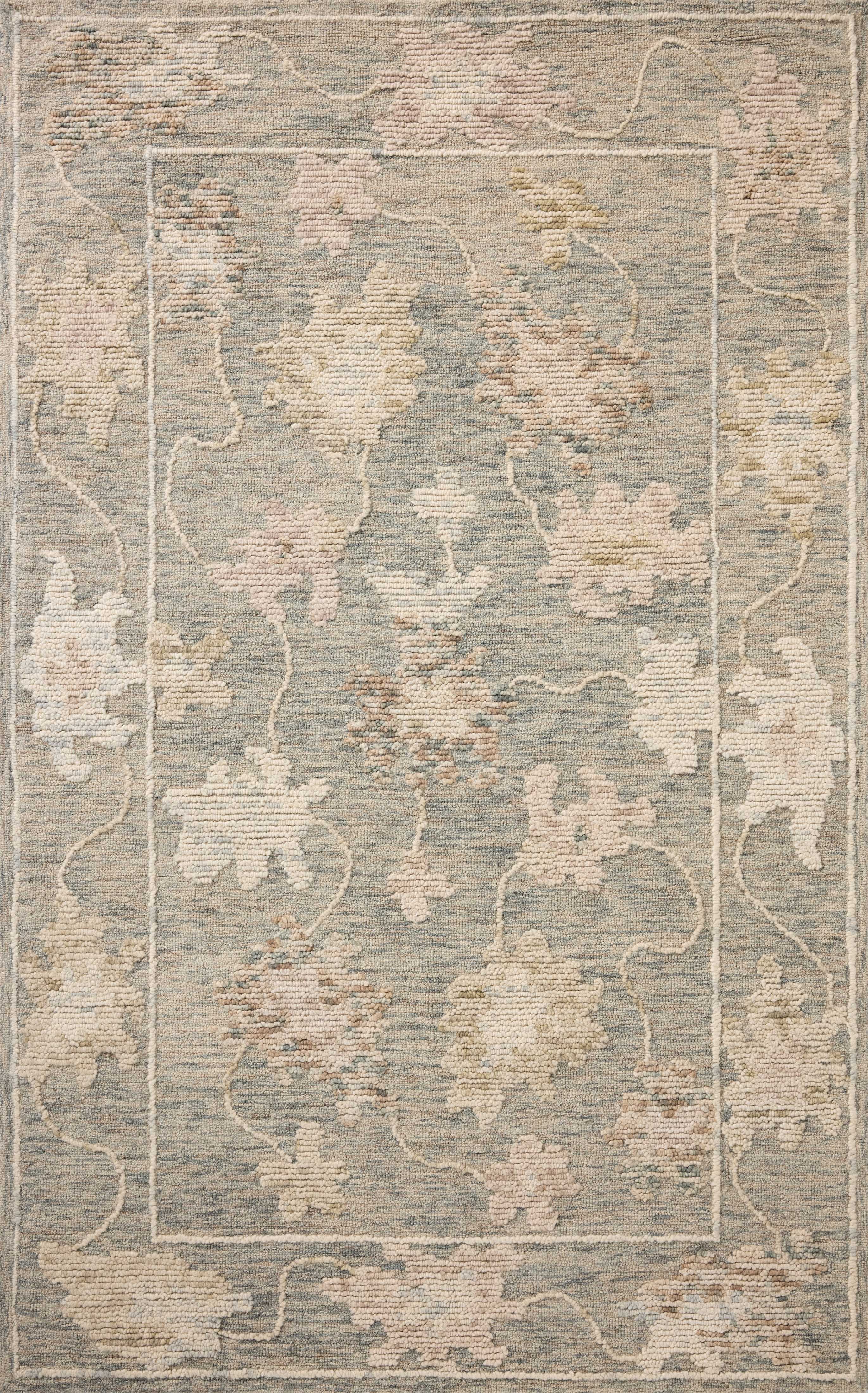 A hand-tufted wool area rug with floral flair in casual denim and calming blue tones, the Cynthia CYN-03 Denim / Blue Area Rug anchors any room