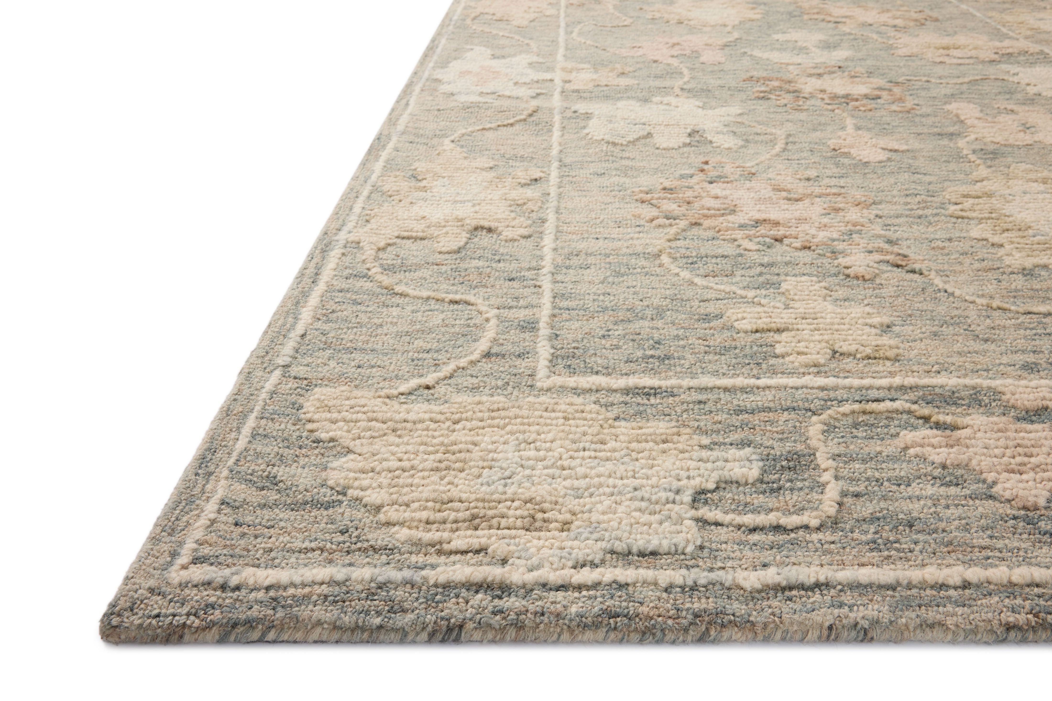 A hand-tufted wool area rug with floral flair in casual denim and calming blue tones, the Cynthia CYN-03 Denim / Blue Area Rug anchors any room