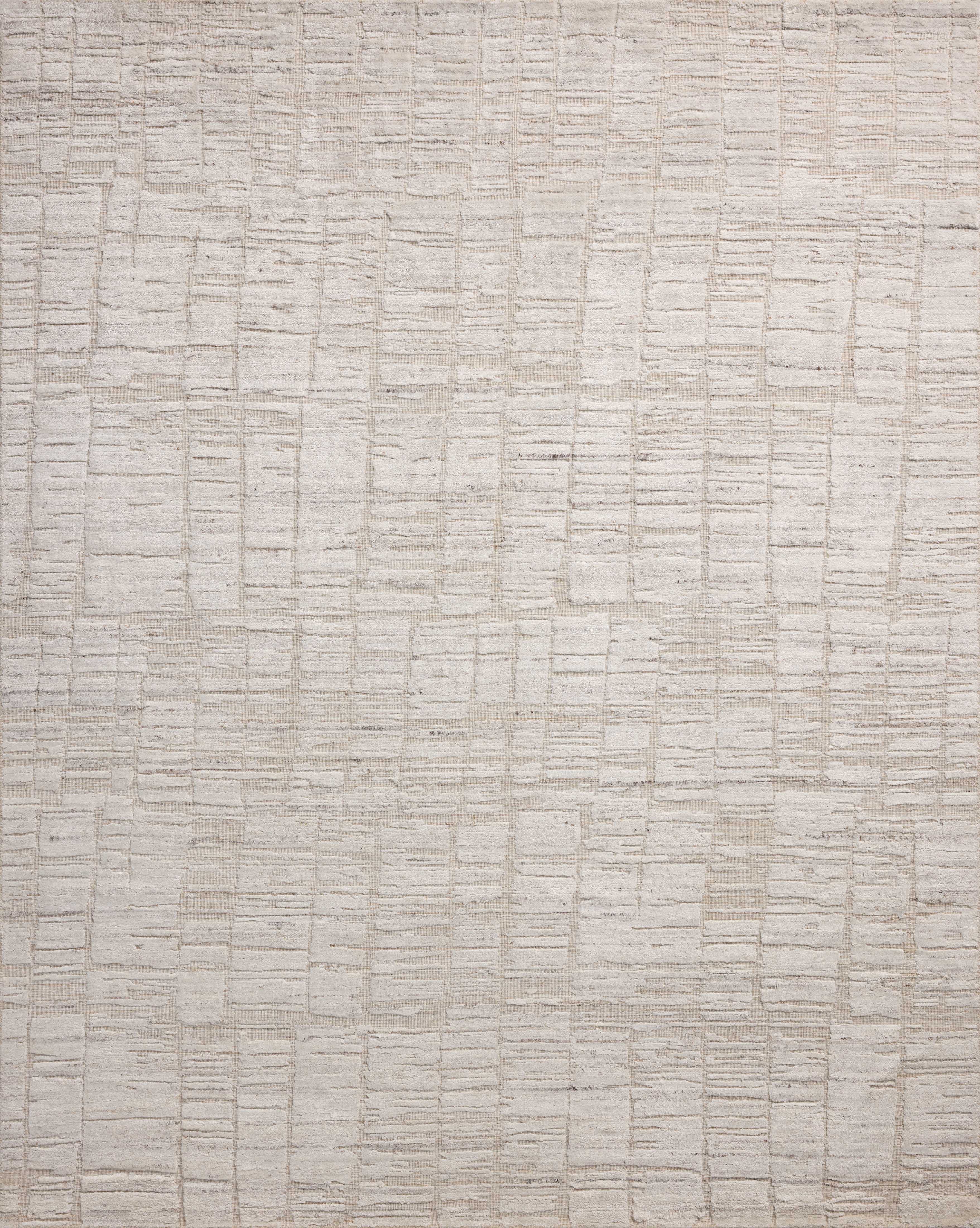 Rich in antique ivory hues with ribbed and graphic detail, the Daniel DAN-01 Antique Ivory Area Rug is a hand-loomed bamboo and wool area rug built for style and comfort
