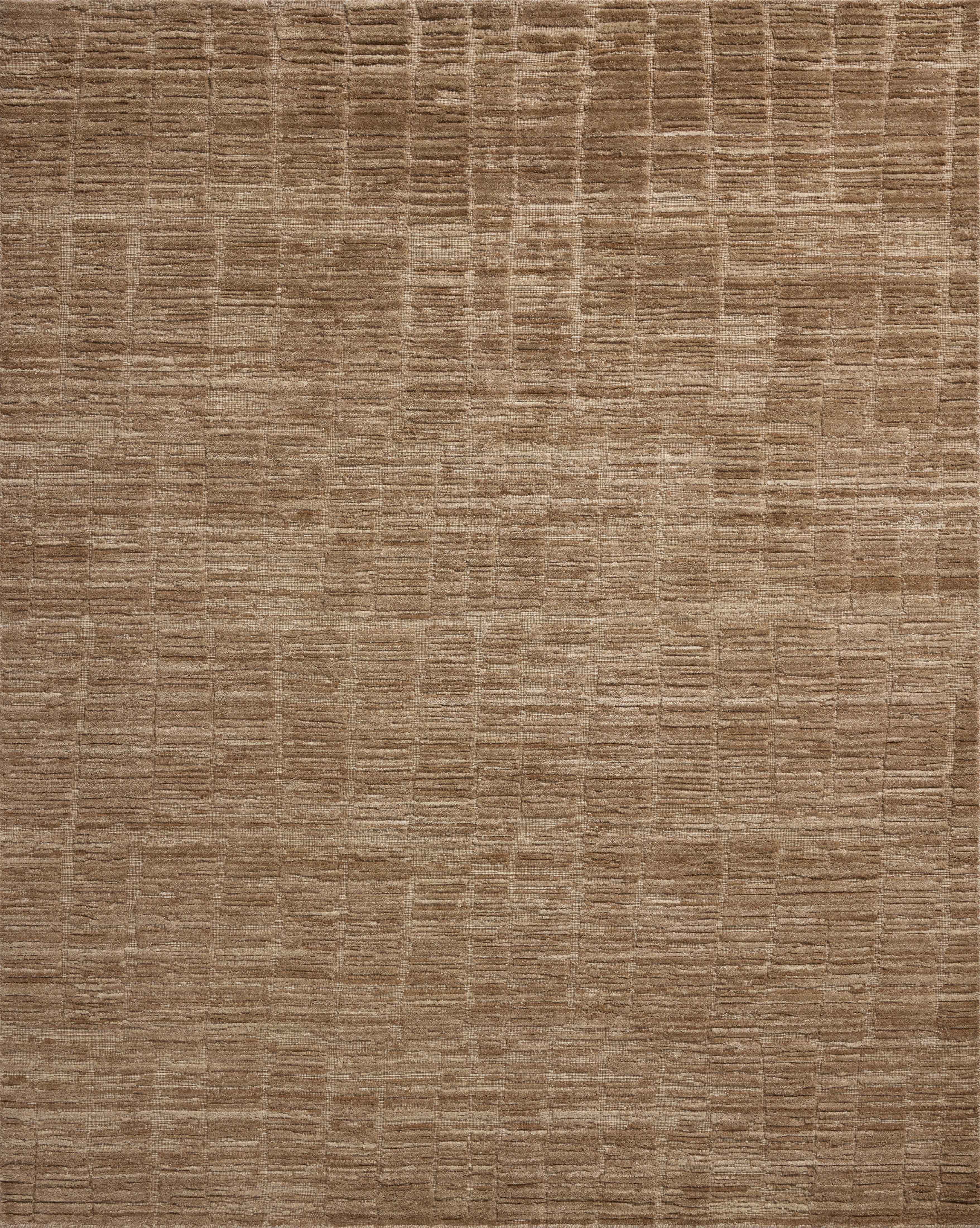 The Daniel DAN-01 Fawn Area Rug offers warm fawn sophistication and ribbed and graphic charm in a hand-loomed bamboo and wool area rug