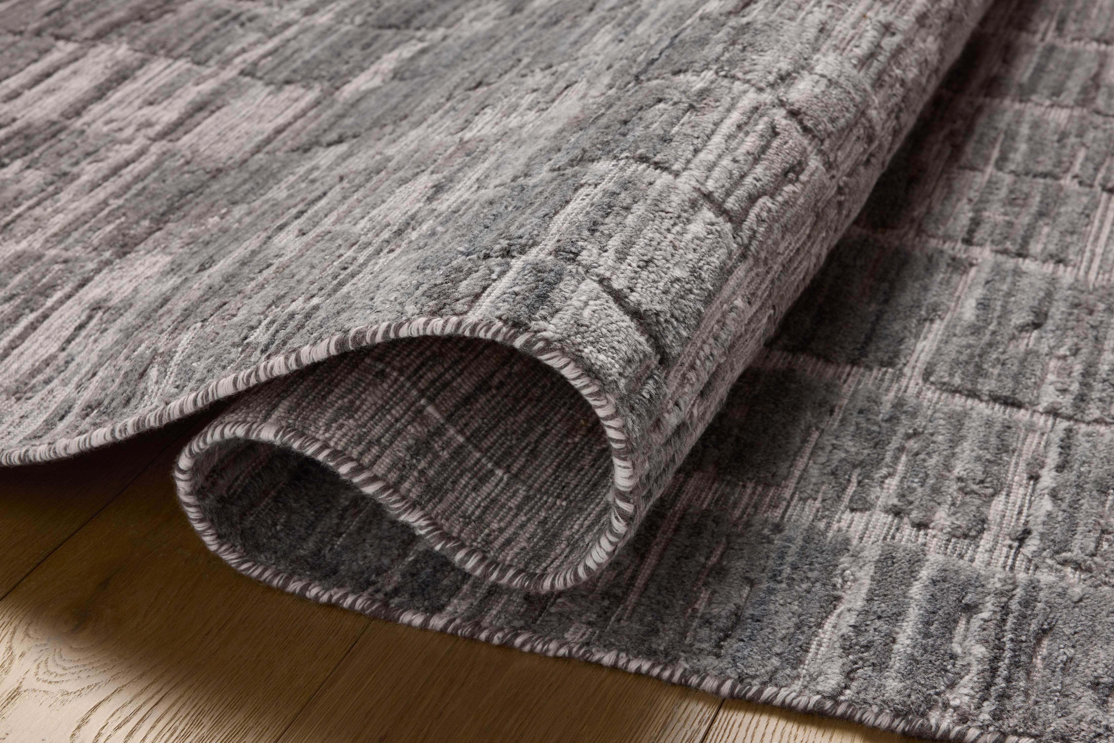 Expertly crafted as a hand-loomed bamboo and wool area rug with ribbed and graphic artistry, the Daniel DAN-01 Slate Area Rug captures cool slate tones beautifully