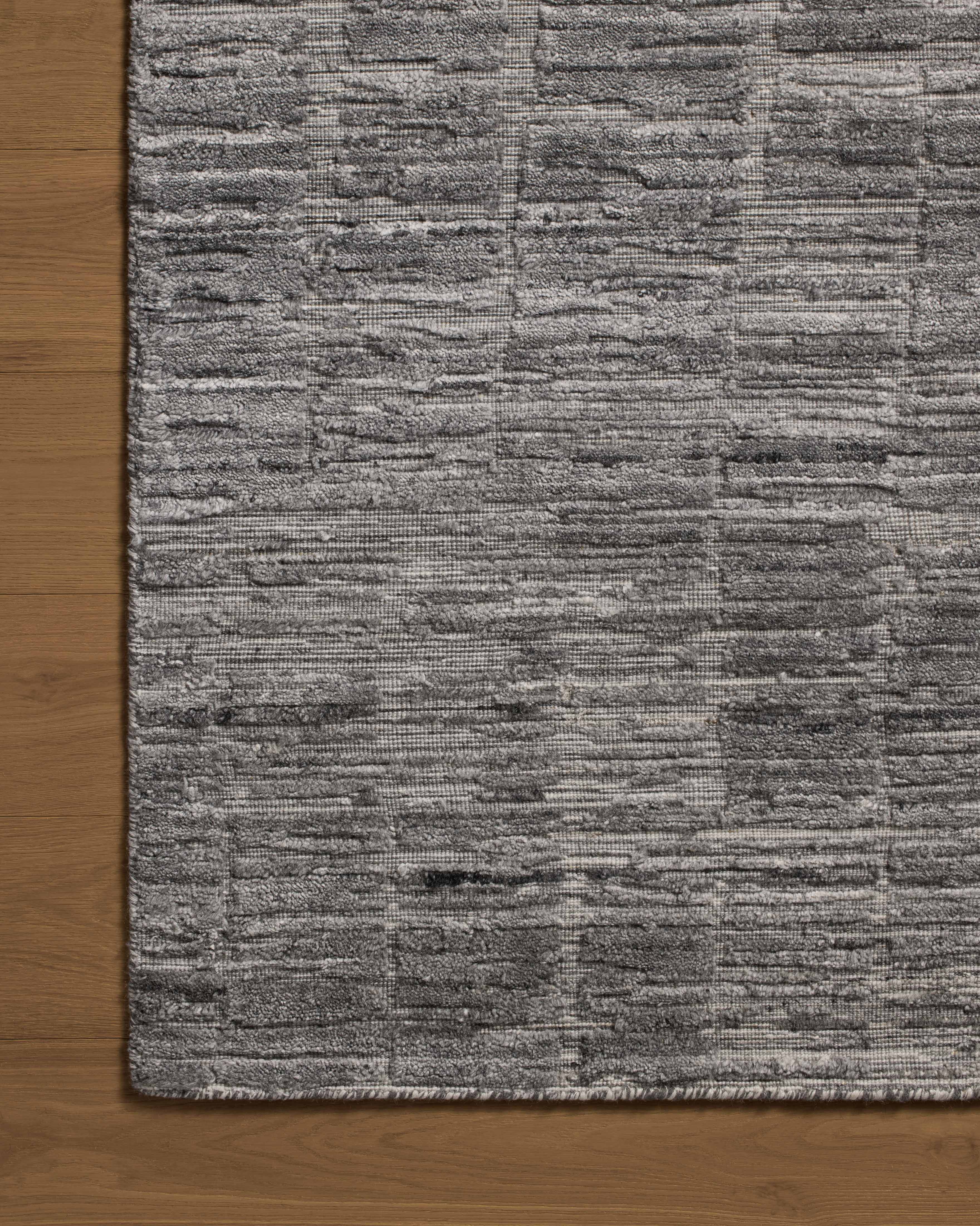 Expertly crafted as a hand-loomed bamboo and wool area rug with ribbed and graphic artistry, the Daniel DAN-01 Slate Area Rug captures cool slate tones beautifully