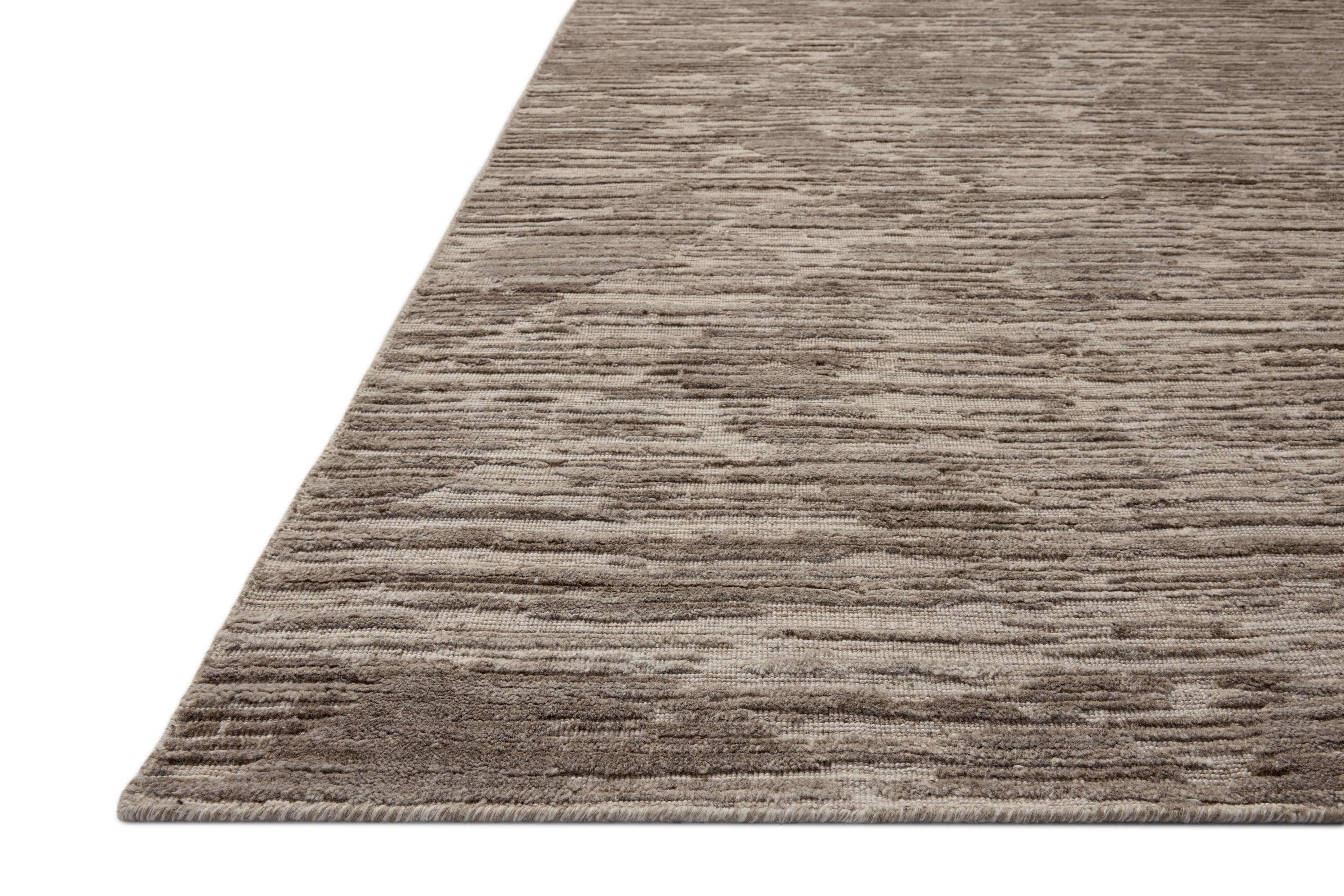 The Daniel DAN-02 Dove Area Rug brings gentle dove character and ribbed and graphic flair to your home in a hand-loomed bamboo and wool area rug