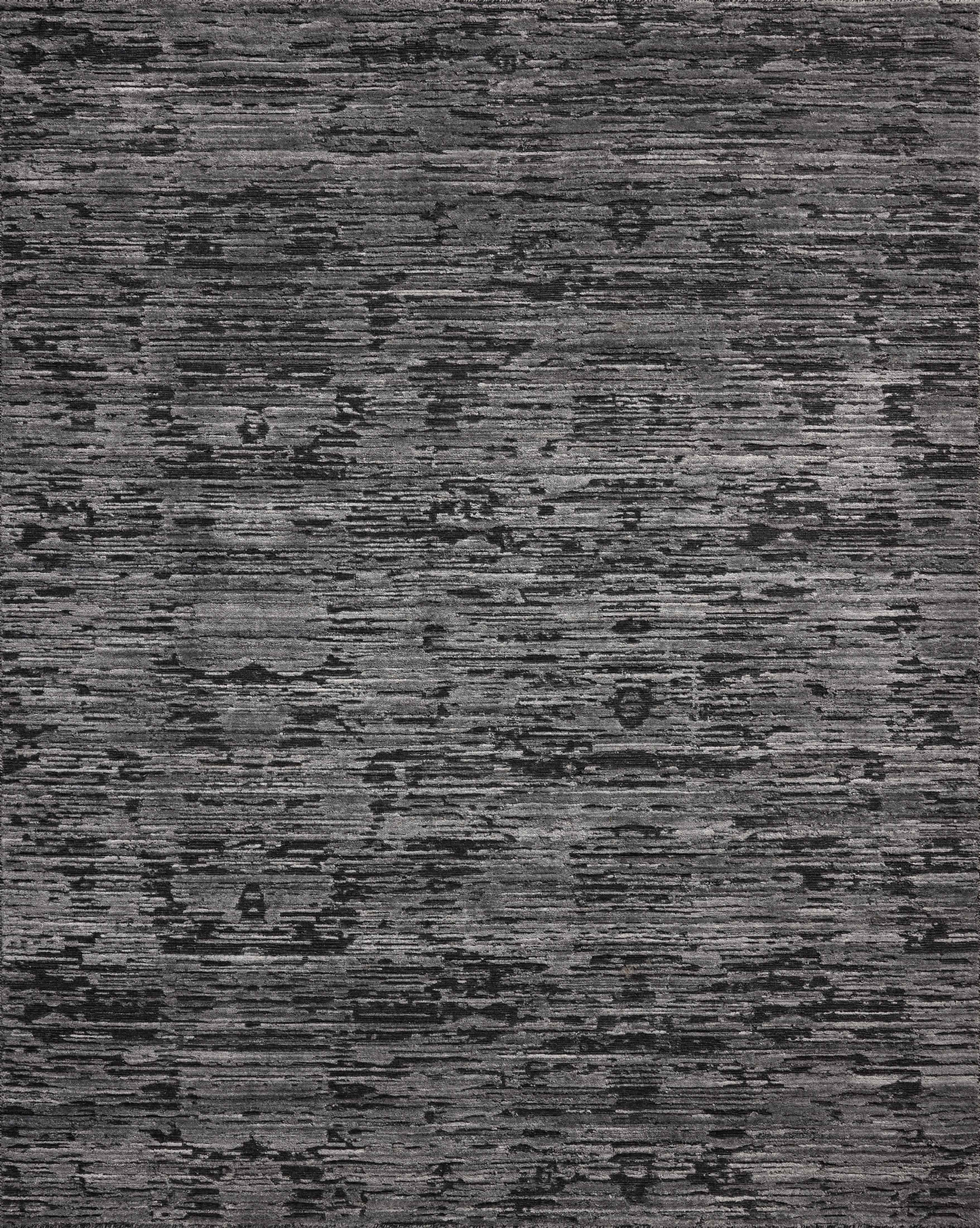 A hand-loomed bamboo and wool area rug with ribbed and graphic design in deep charcoal hues, the Daniel DAN-03 Charcoal Area Rug is a standout in any décor