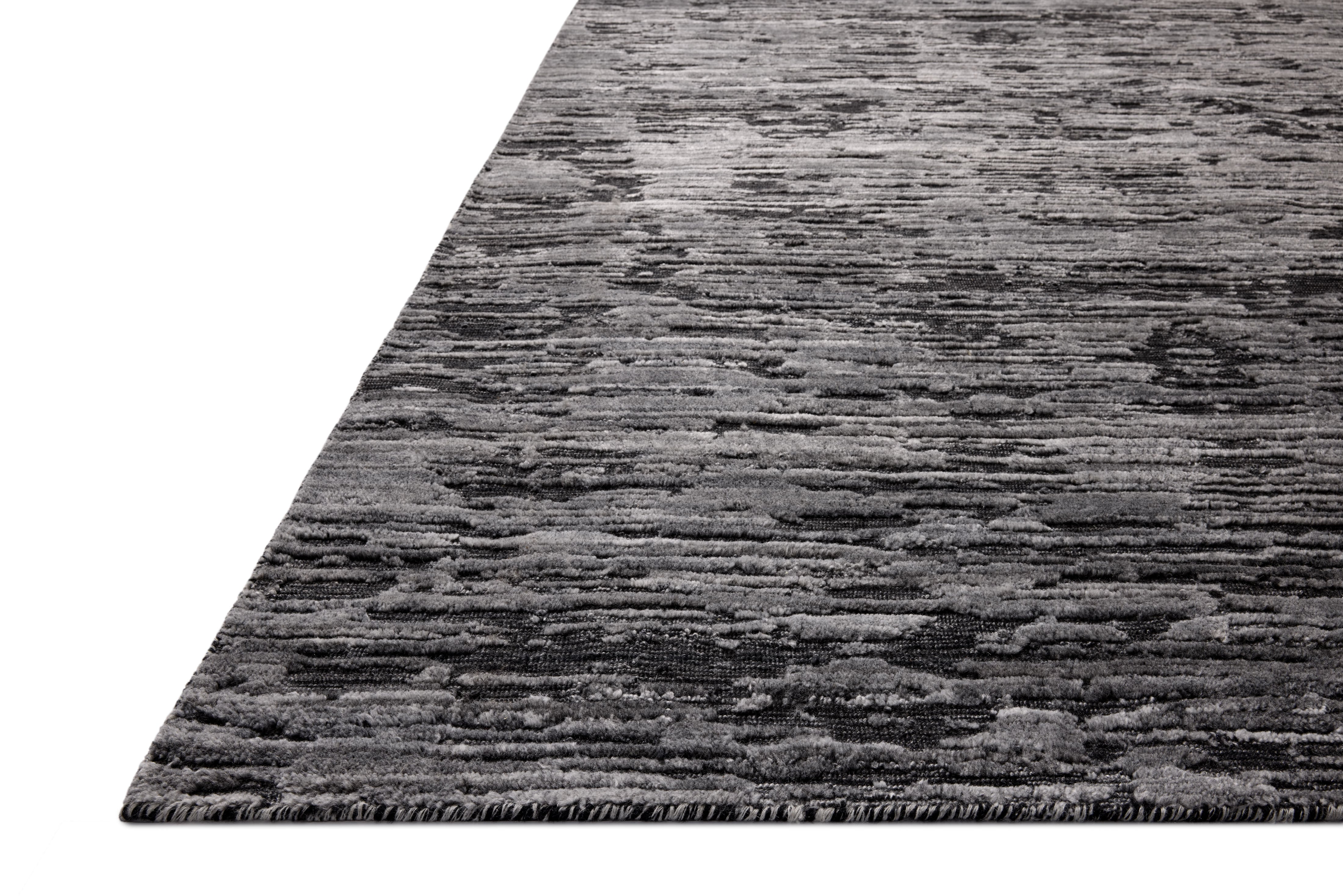 A hand-loomed bamboo and wool area rug with ribbed and graphic design in deep charcoal hues, the Daniel DAN-03 Charcoal Area Rug is a standout in any décor