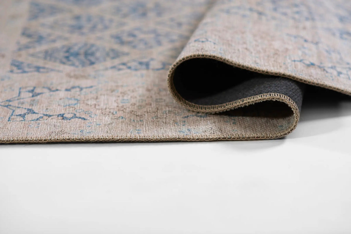 Erin Gates by Momeni Dorset DOR-3 blue area rug featuring vintage-inspired pattern, durable machine-made construction, and stitched edge.
