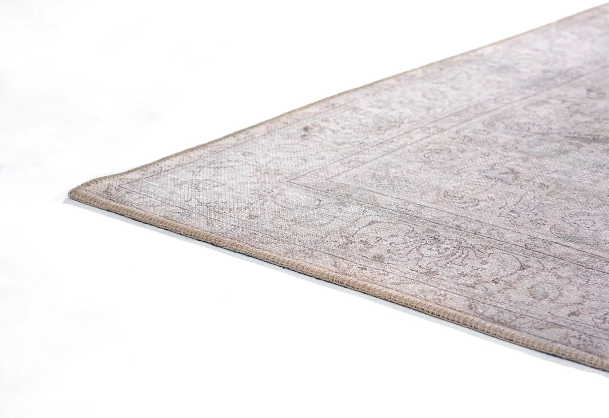 Erin Gates by Momeni Dorset DOR-4 gray area rug corner showing vintage medallion pattern and stitched border on white background.