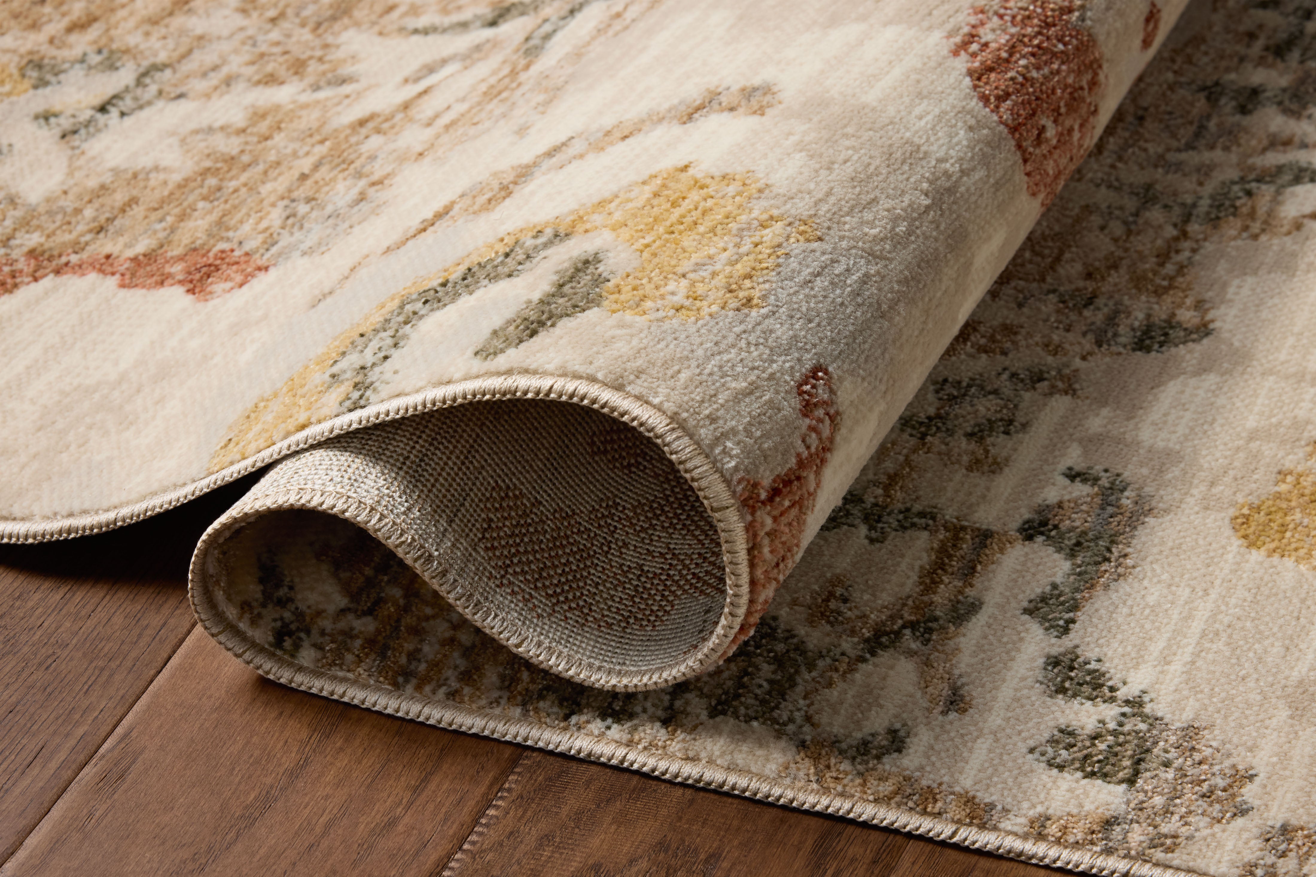 The Eileen ELE-02 Mist / Sunset Area Rug showcases soft misty and glowing sunset tones in a power-loomed polypropylene and polyester area rug with botanical style
