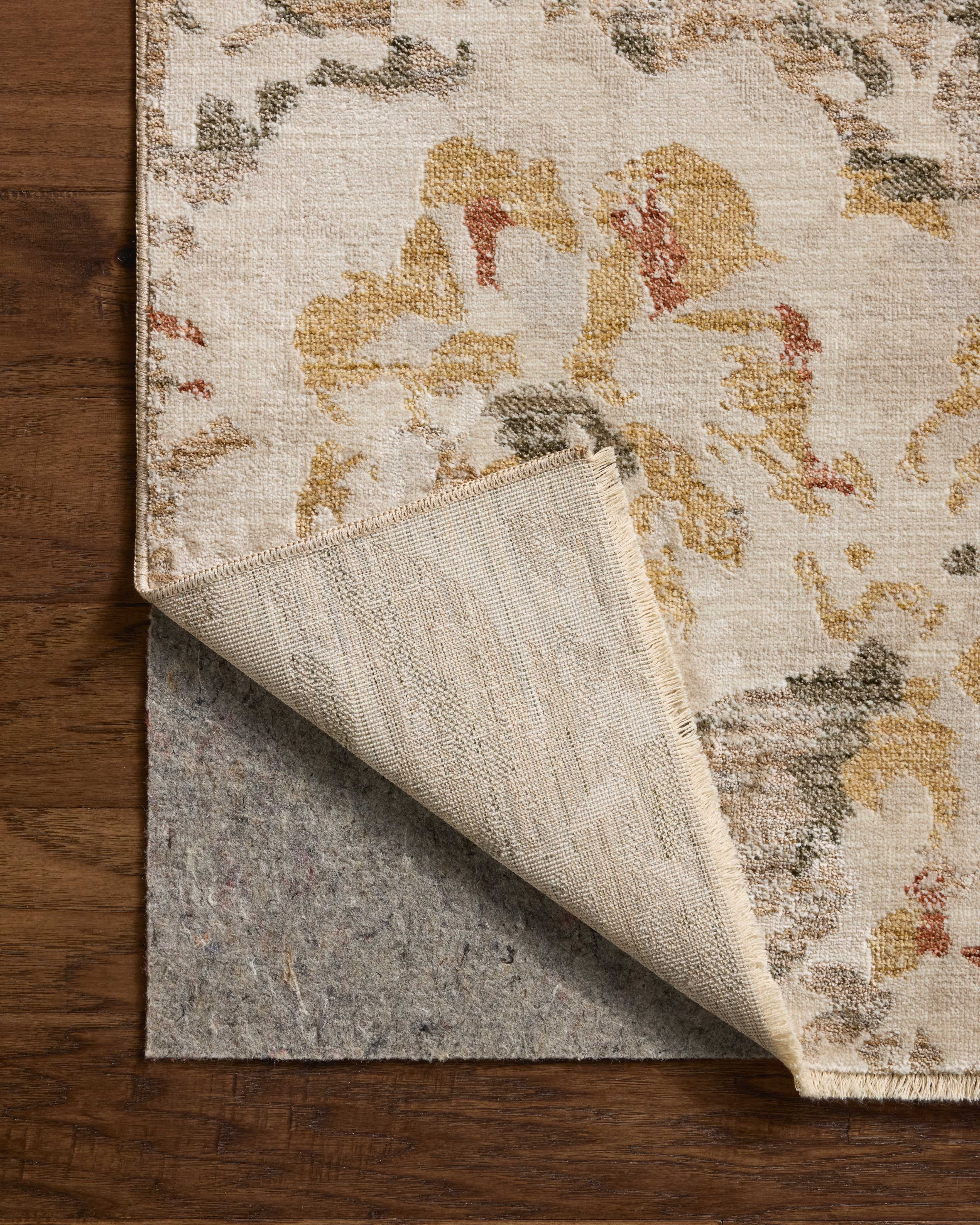 The Eileen ELE-02 Mist / Sunset Area Rug showcases soft misty and glowing sunset tones in a power-loomed polypropylene and polyester area rug with botanical style