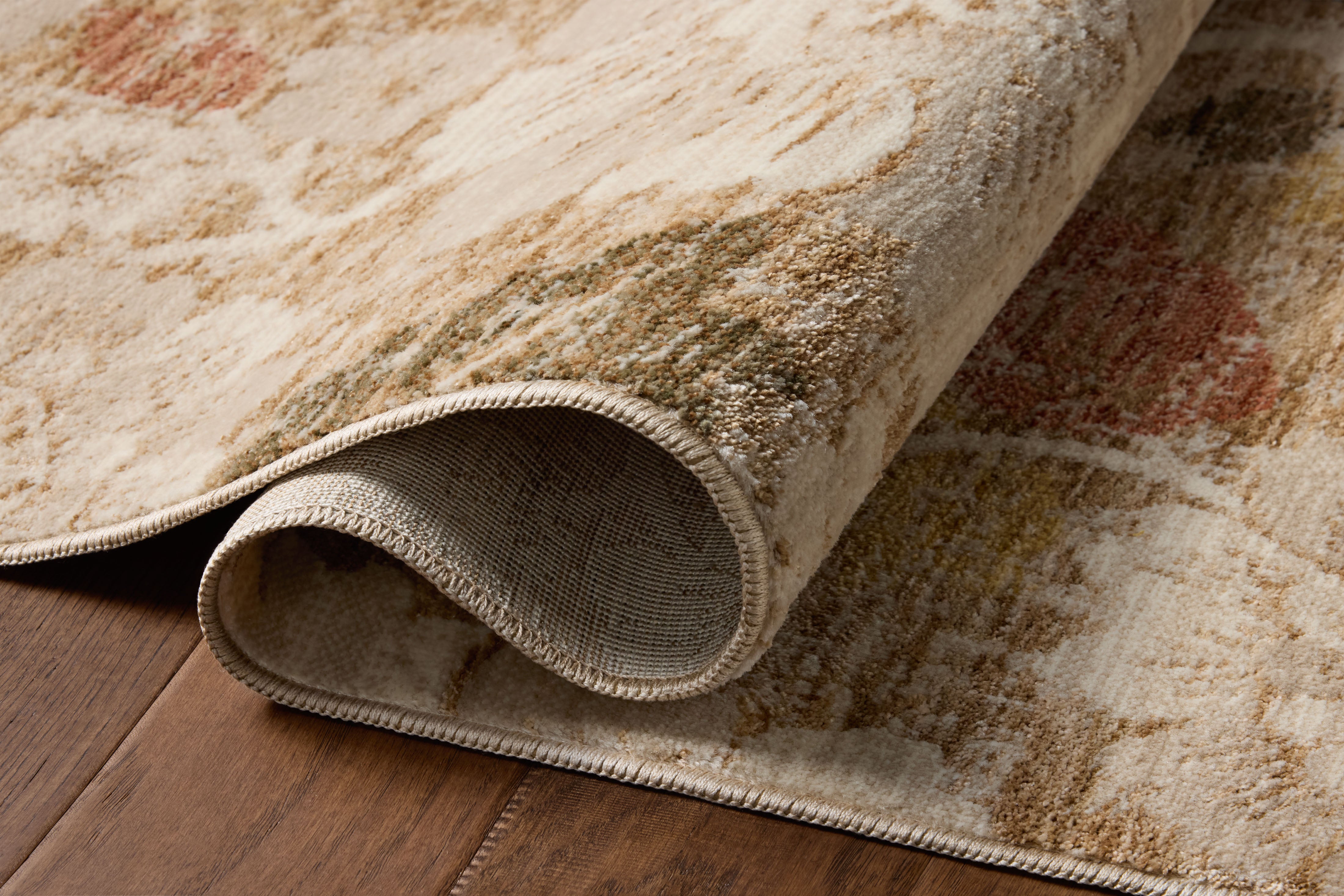 A power-loomed polypropylene and polyester area rug with botanical flair in warm natural and vibrant multi-toned tones, the Eileen ELE-03 Natural / Multi Area Rug anchors any room