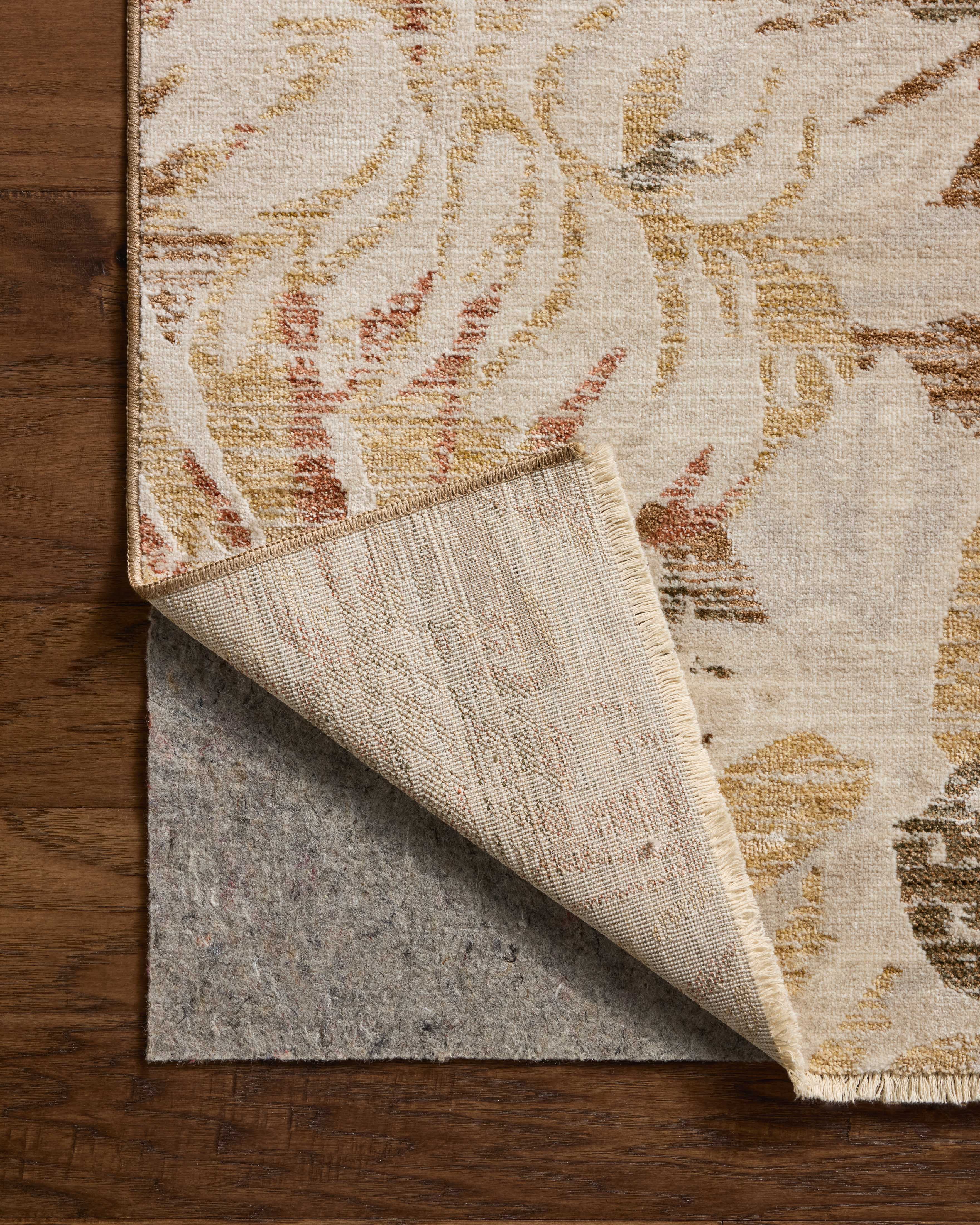 Crafted as a power-loomed polypropylene and polyester area rug, the Eileen ELE-04 Natural / Spice Area Rug brings warm natural and spirited spice warmth and botanical character to your space
