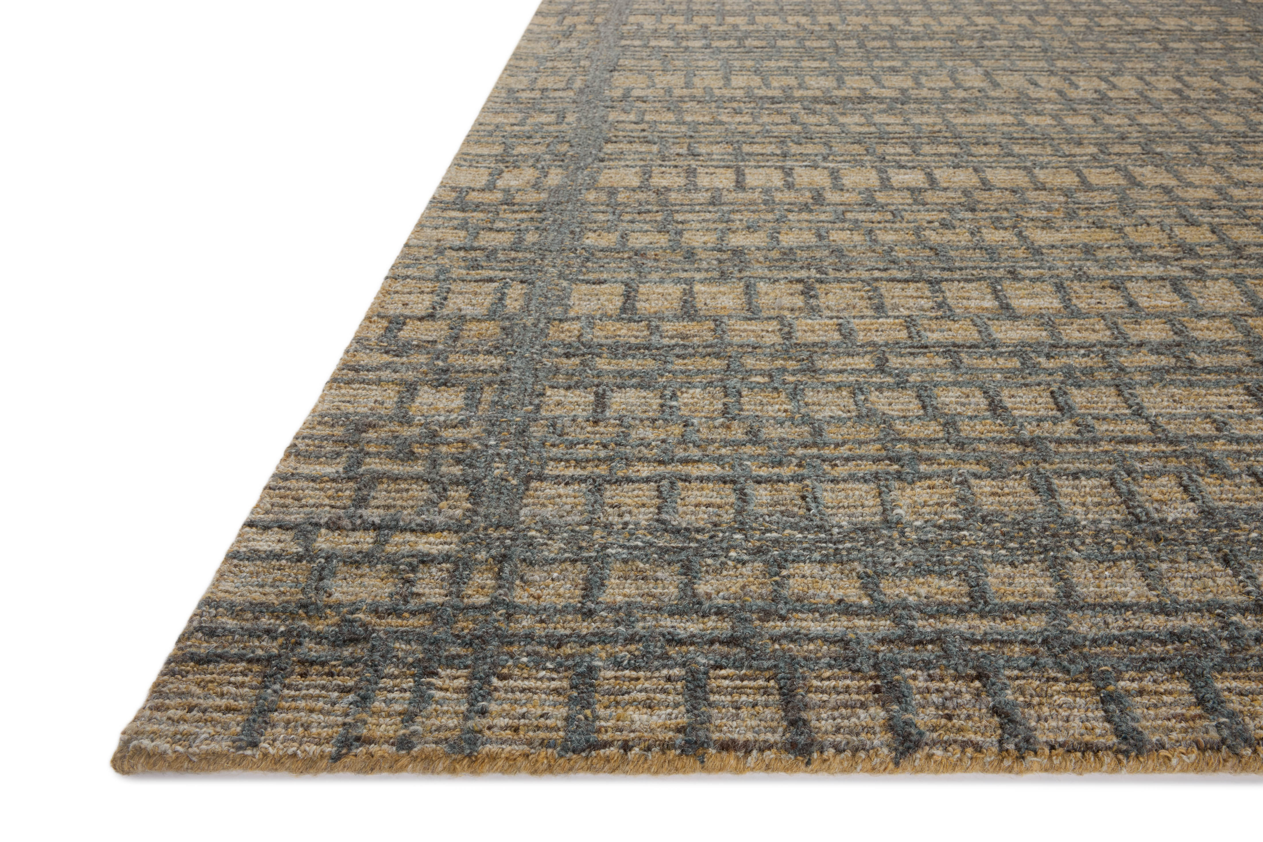 The Elias ELA-05 Wheat / Charcoal Area Rug offers golden wheat and deep charcoal sophistication and graphic and high-low textured charm in a hand-tufted wool area rug