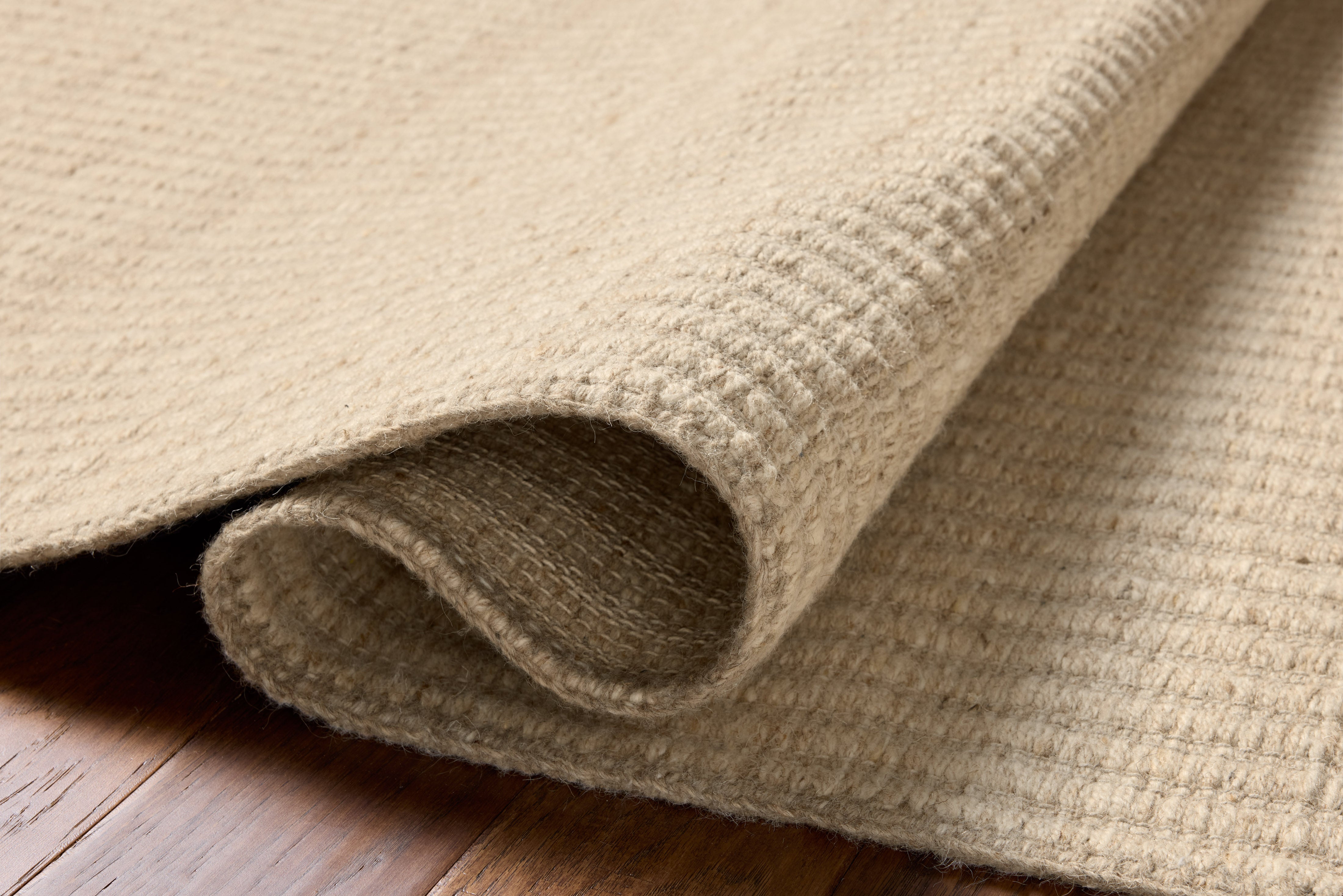 The Elma ELM-01 Bone Area Rug blends bone tones and striped motifs into a hand-woven wool and cotton area rug with timeless appeal