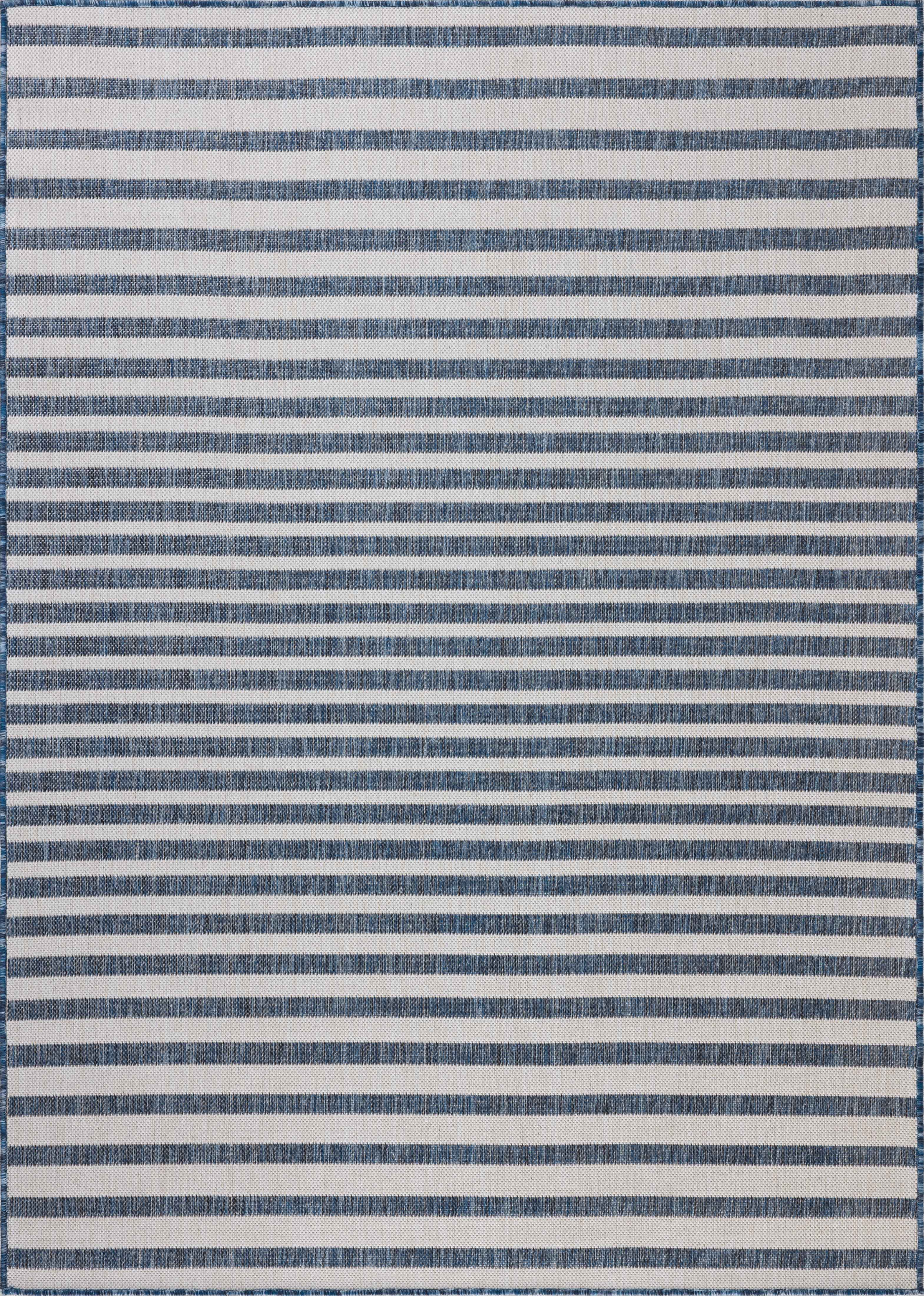 The Easton ESN-03 Denim / Ivory Area Rug delivers casual denim and refined ivory beauty in a power-loomed polypropylene area rug