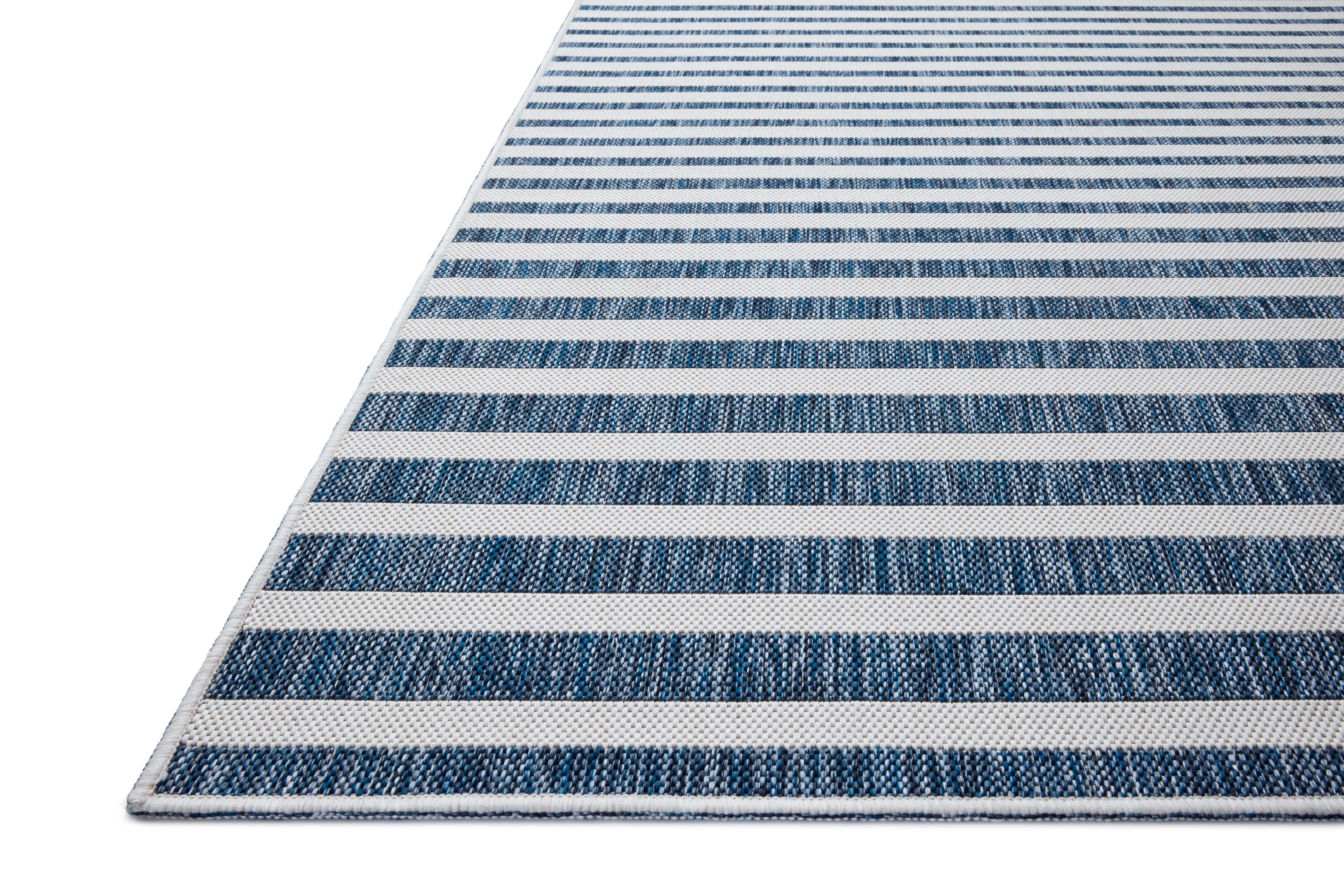 The Easton ESN-03 Denim / Ivory Area Rug delivers casual denim and refined ivory beauty in a power-loomed polypropylene area rug