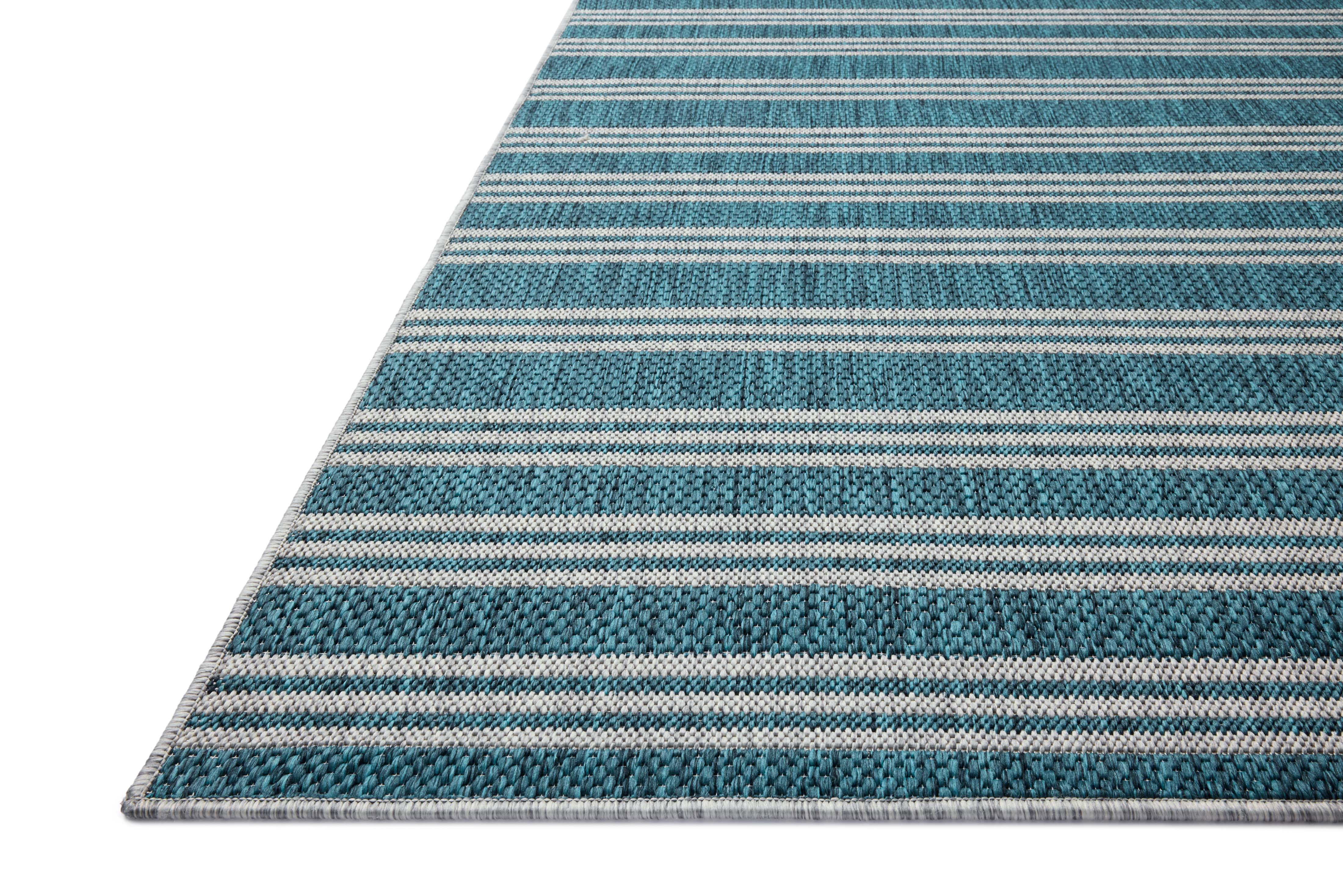 Designed in vibrant teal and misty hues, the Easton ESN-04 Teal / Fog Area Rug is a power-loomed polypropylene area rug that stands out
