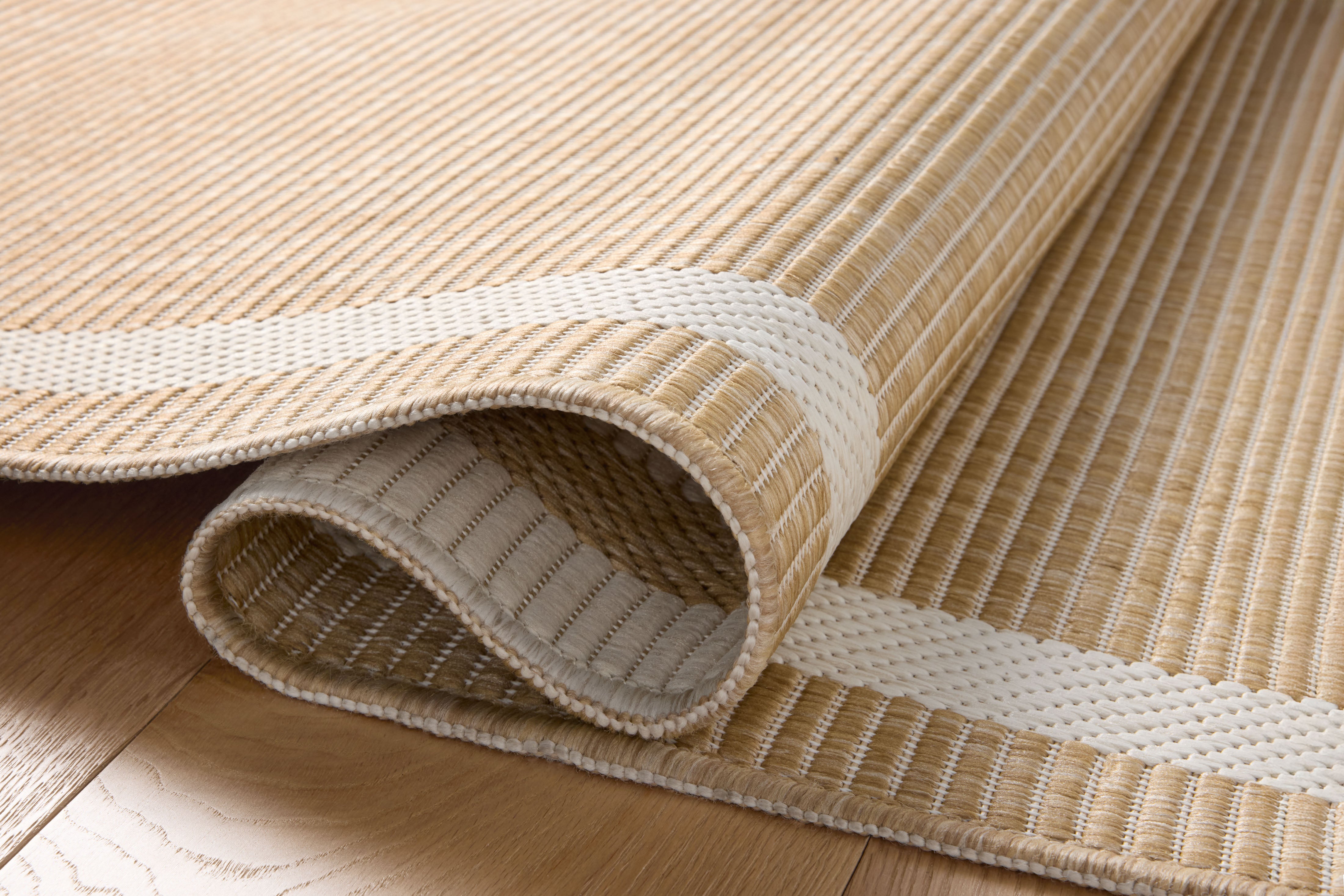 The Easton ESN-05 Wheat / Ivory Area Rug combines golden wheat and refined ivory tones with a power-loomed polypropylene area rug for effortless elegance