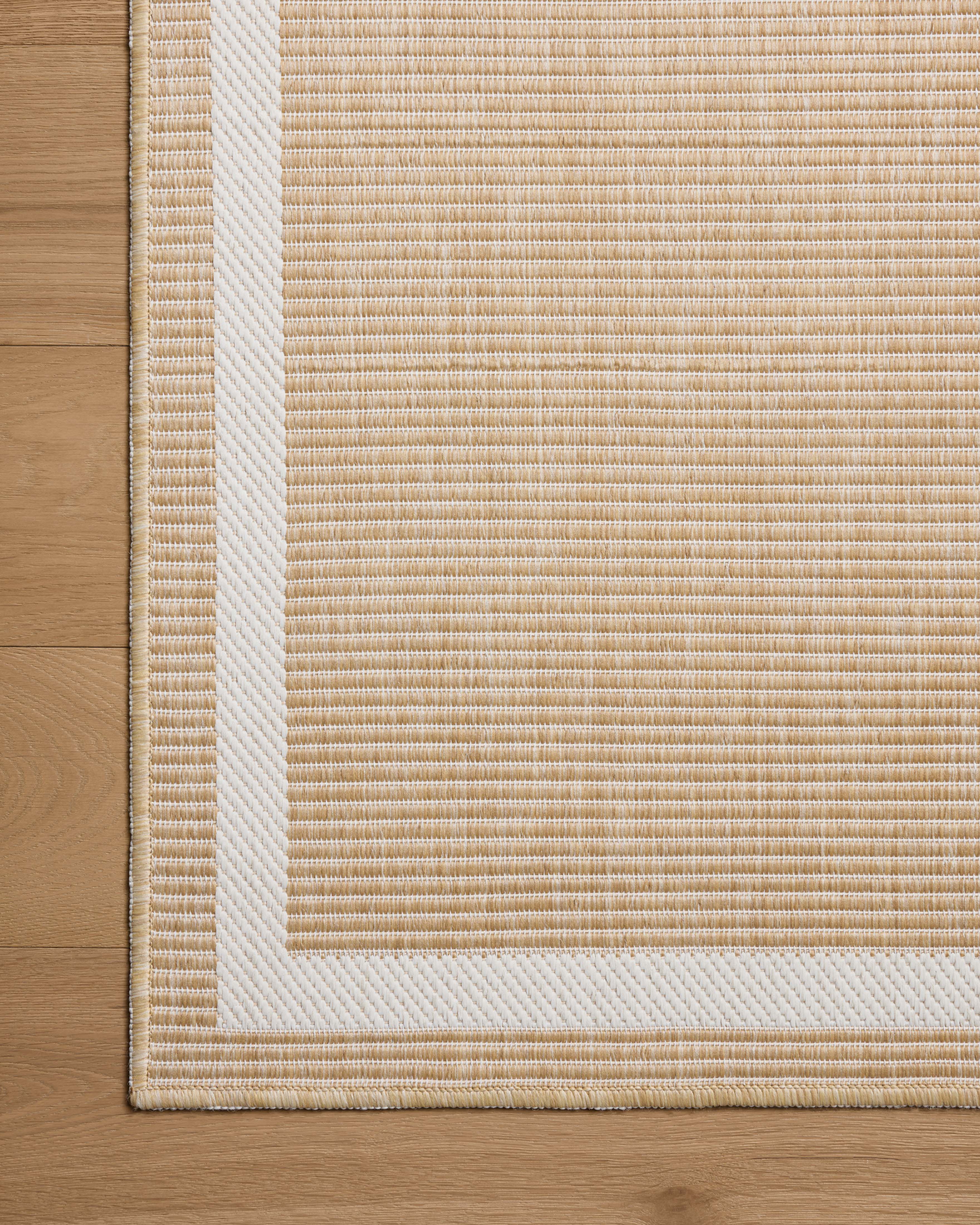 The Easton ESN-05 Wheat / Ivory Area Rug combines golden wheat and refined ivory tones with a power-loomed polypropylene area rug for effortless elegance