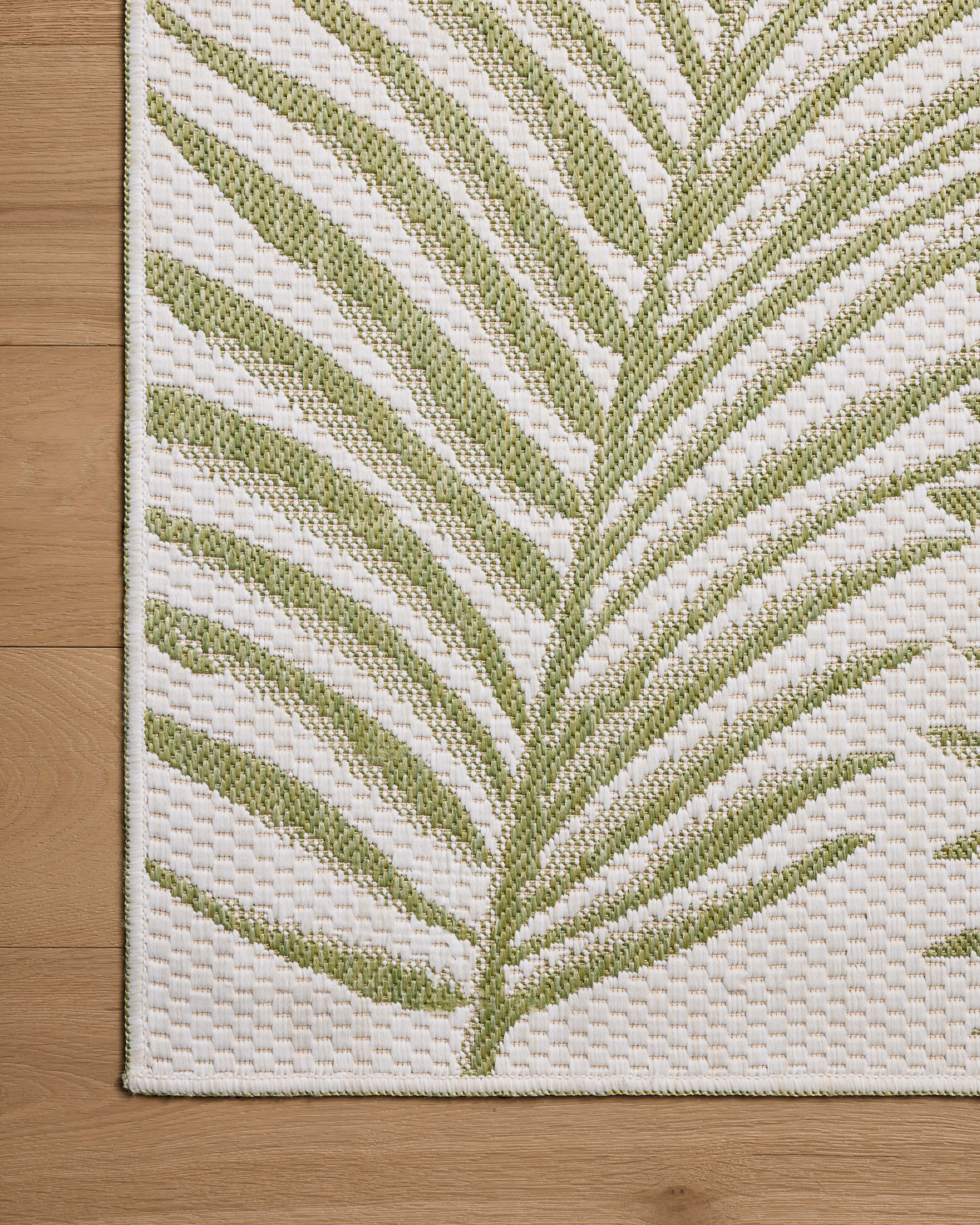 A power-loomed polypropylene area rug with refined ivory and green tones, the Easton ESN-06 Ivory / Green Area Rug adds character to any room