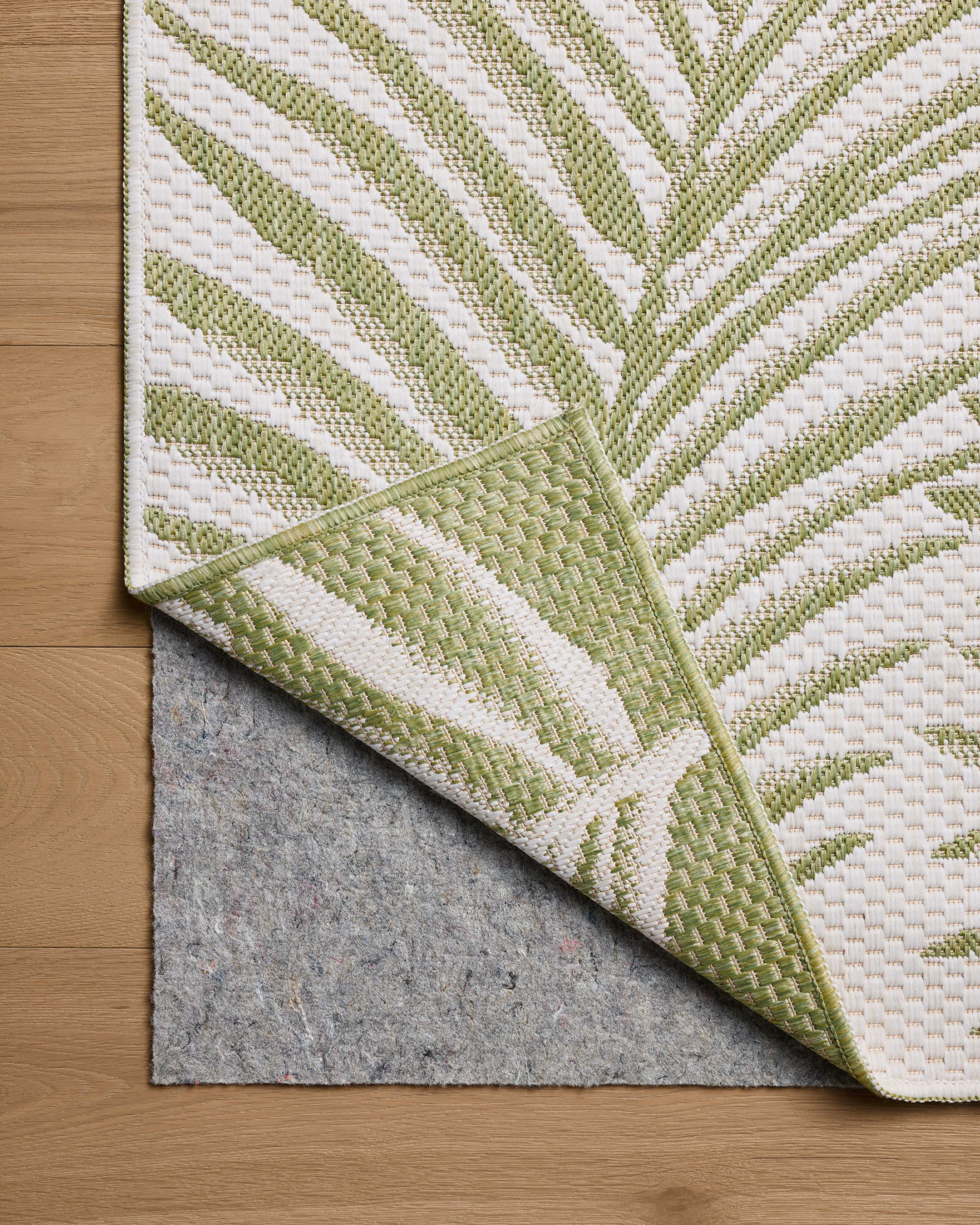 A power-loomed polypropylene area rug with refined ivory and green tones, the Easton ESN-06 Ivory / Green Area Rug adds character to any room