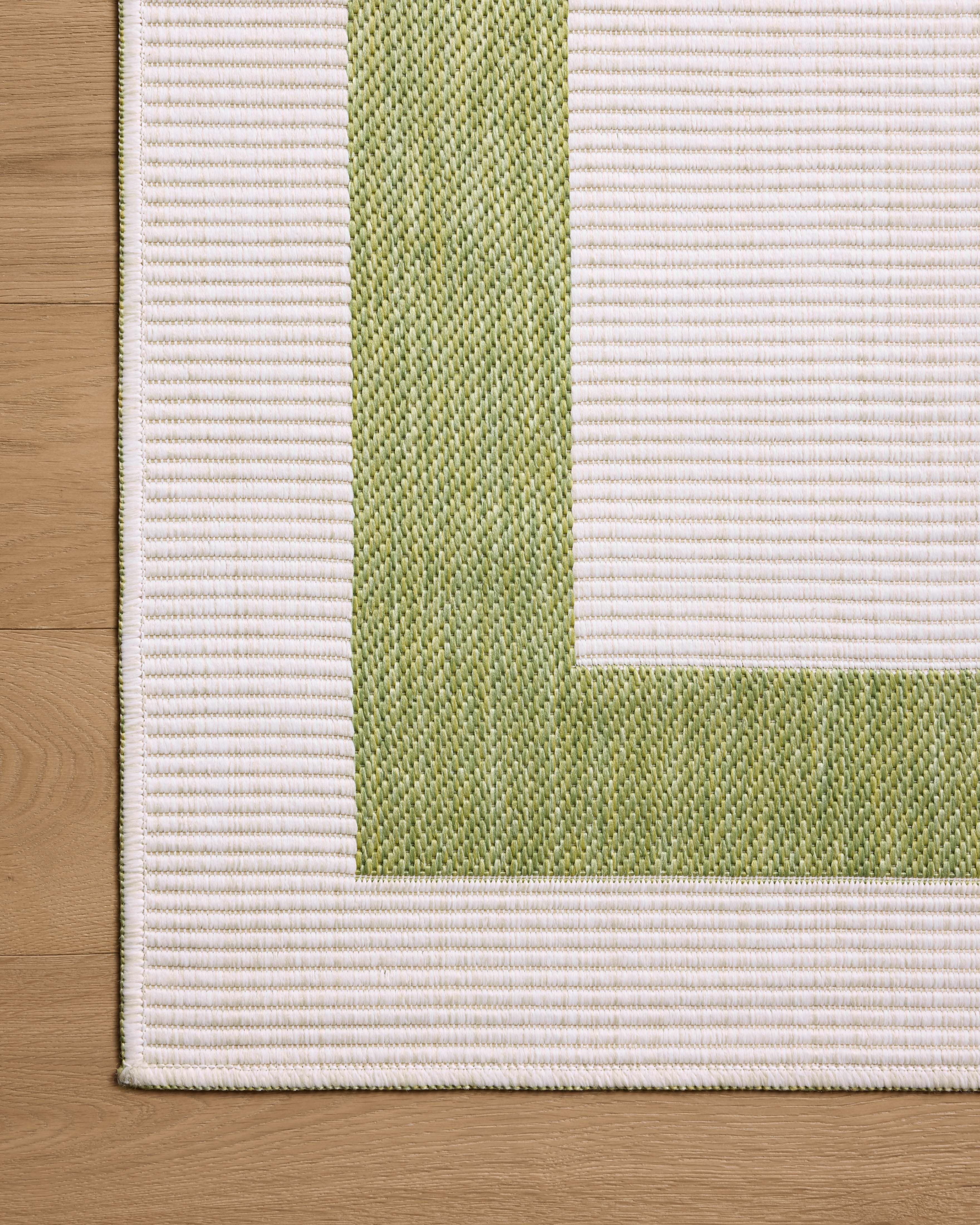 Rich in green and refined ivory hues, the Easton ESN-07 Green / Ivory Area Rug is a power-loomed polypropylene area rug built for style and comfort