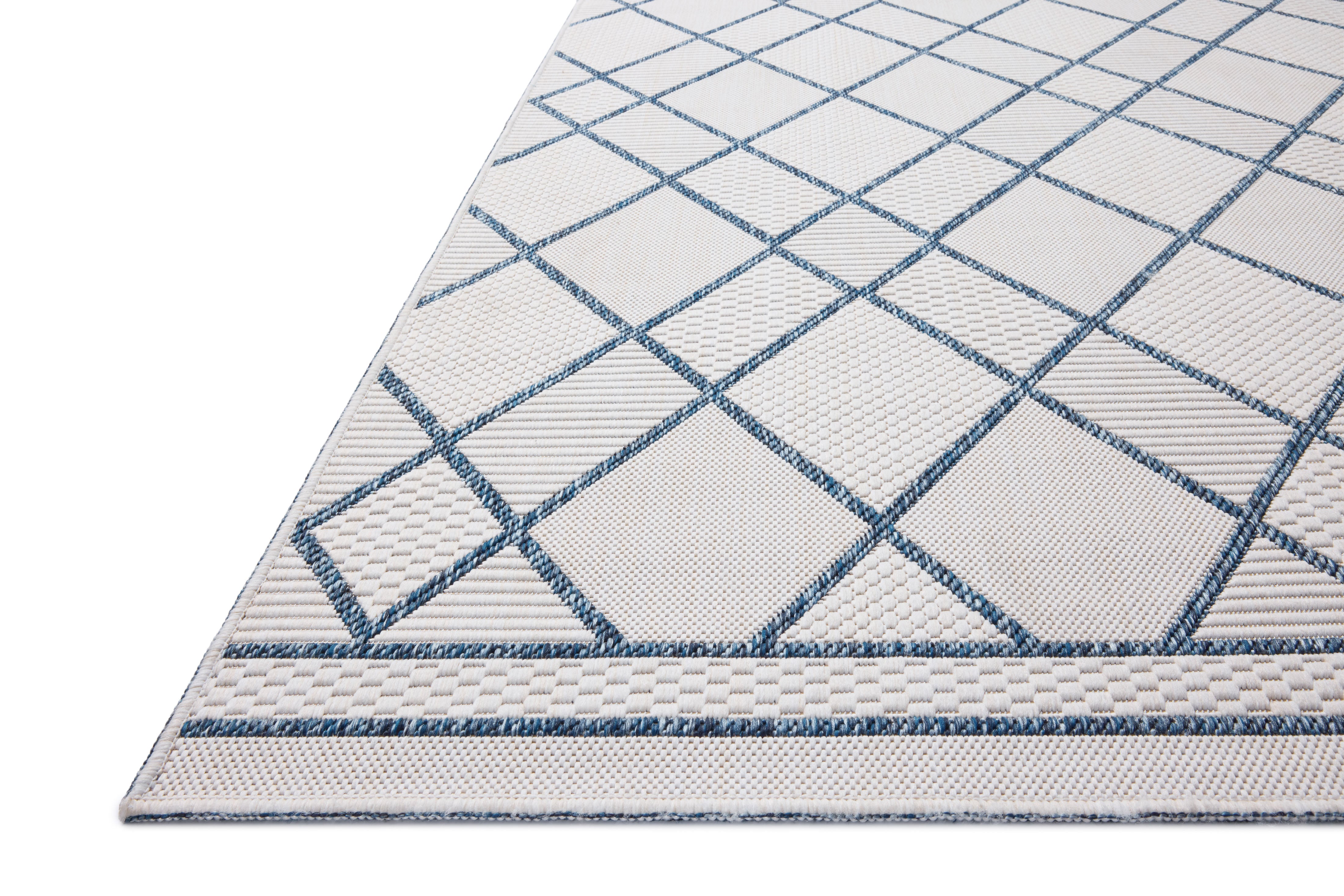 The Easton ESN-08 Ivory / Denim Area Rug offers refined ivory and casual denim sophistication in a power-loomed polypropylene area rug