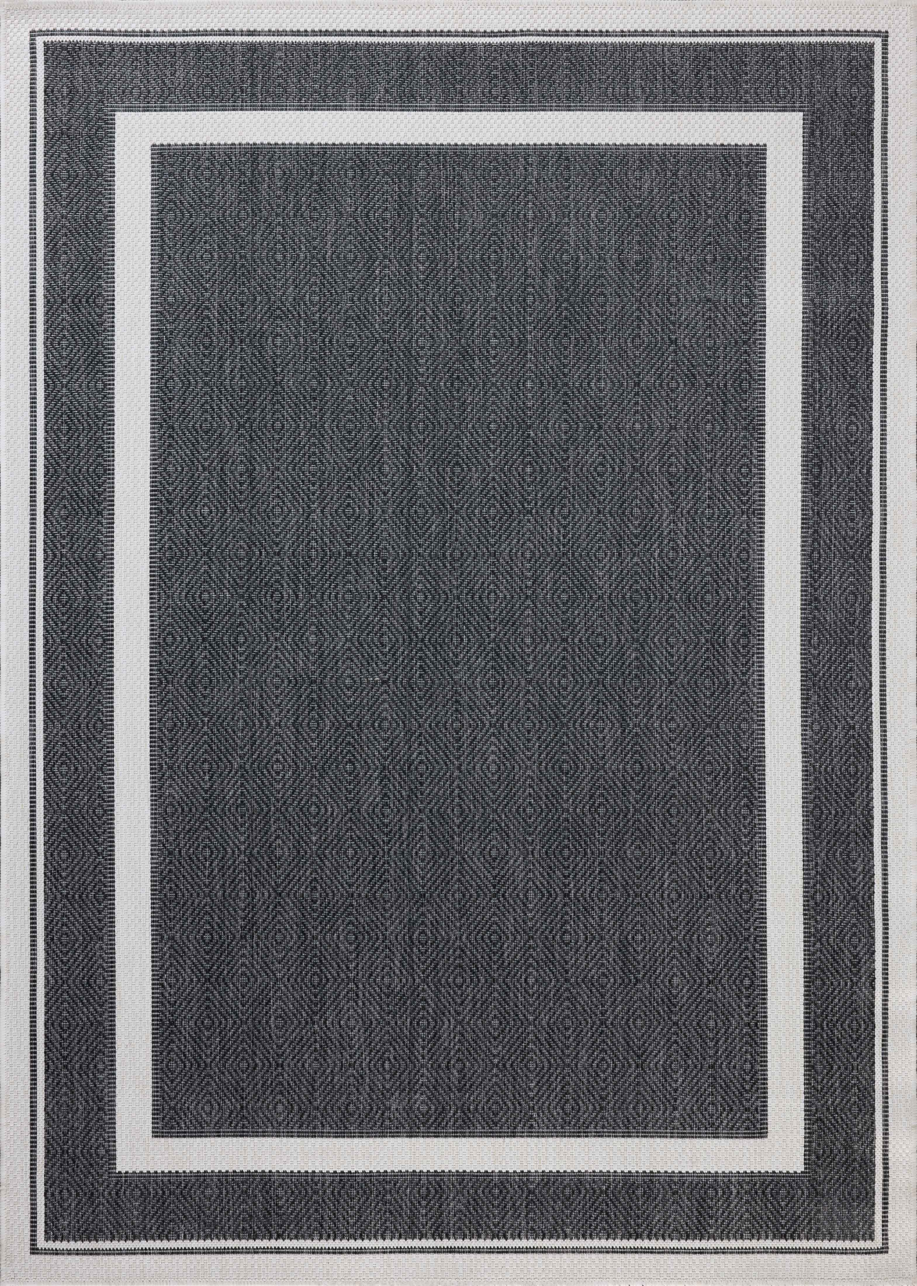 Finished in bold onyx and refined ivory tones, the Easton ESN-11 Onyx / Ivory Area Rug is a power-loomed polypropylene area rug for modern living